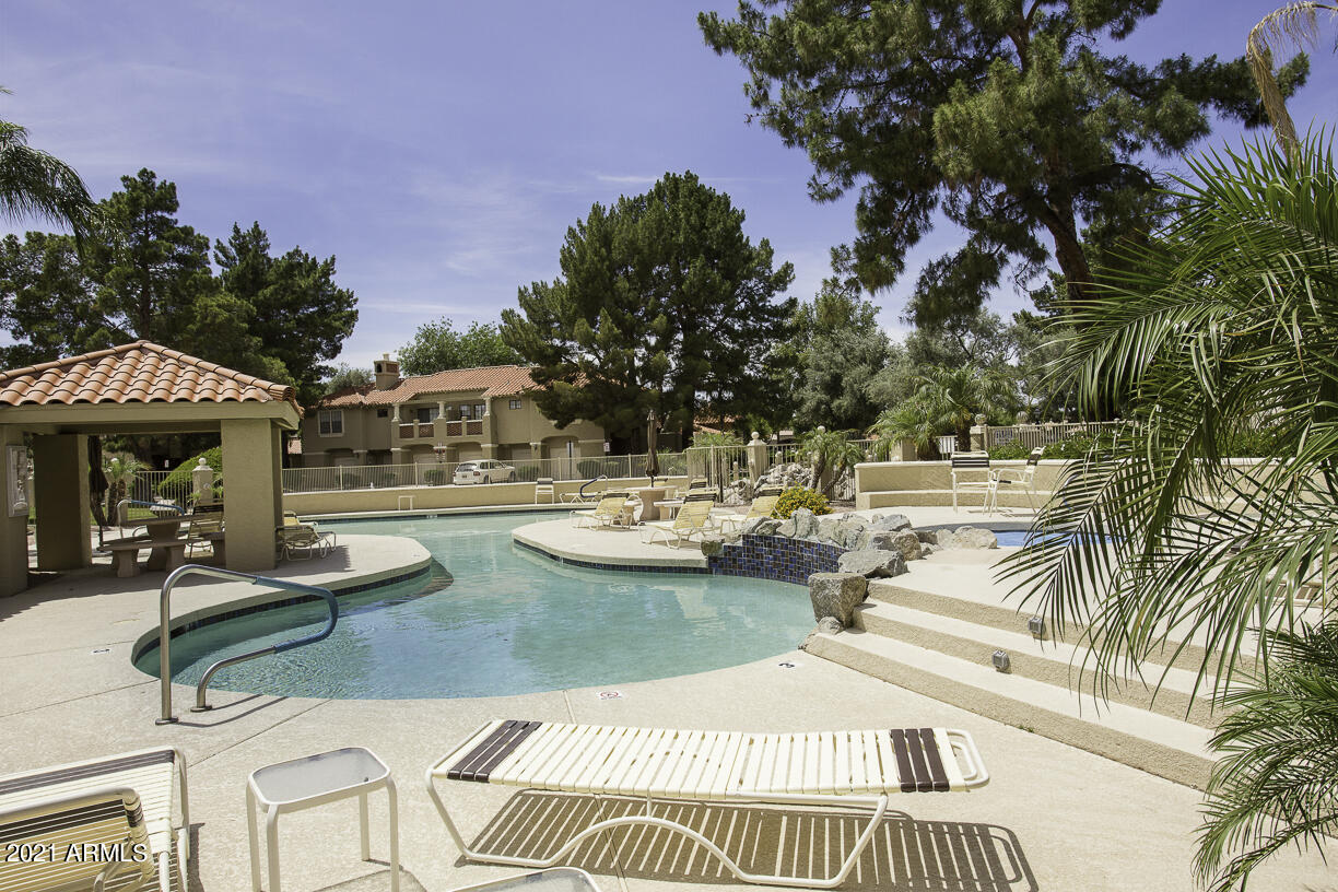 8270 North Hayden Road, Unit 2019 Scottsdale, AZ 85258 - Photo 30 of 39 a view of swimming pool with outdoor seating and plants