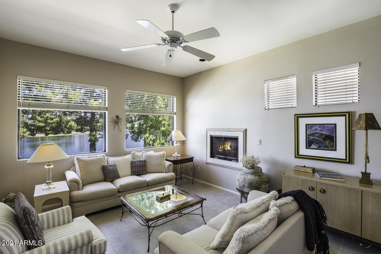 8270 North Hayden Road, Unit 2019 Scottsdale, AZ 85258 - Photo 3 of 39 a living room with furniture large window and flat screen tv