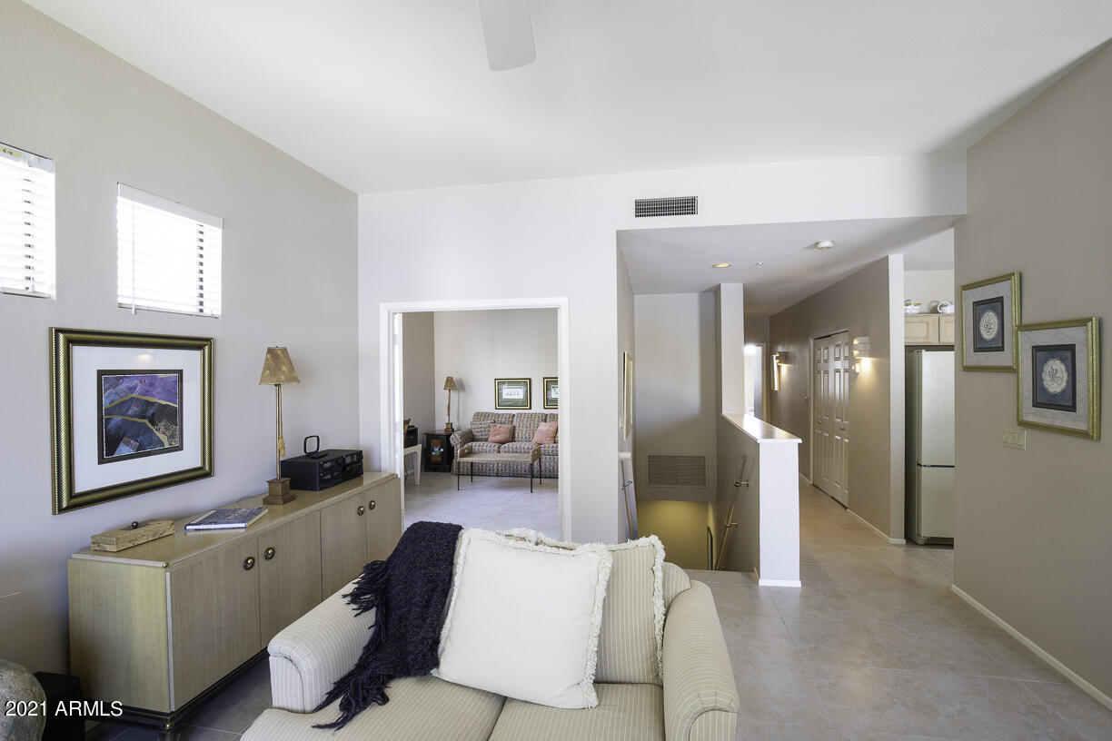 8270 North Hayden Road, Unit 2019 Scottsdale, AZ 85258 - Photo 8 of 39 a living room with furniture large window and wooden floor