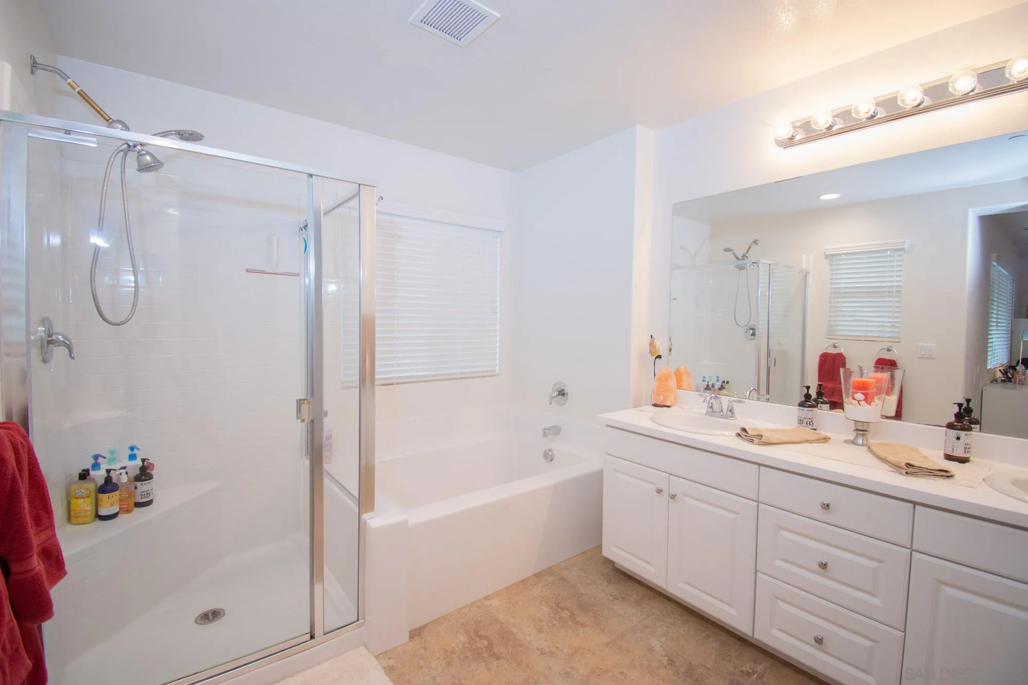 228 Oberlander Way Fallbrook, CA 92028 - Photo 11 of 23 a bathroom with a tub sink double vanity and shower