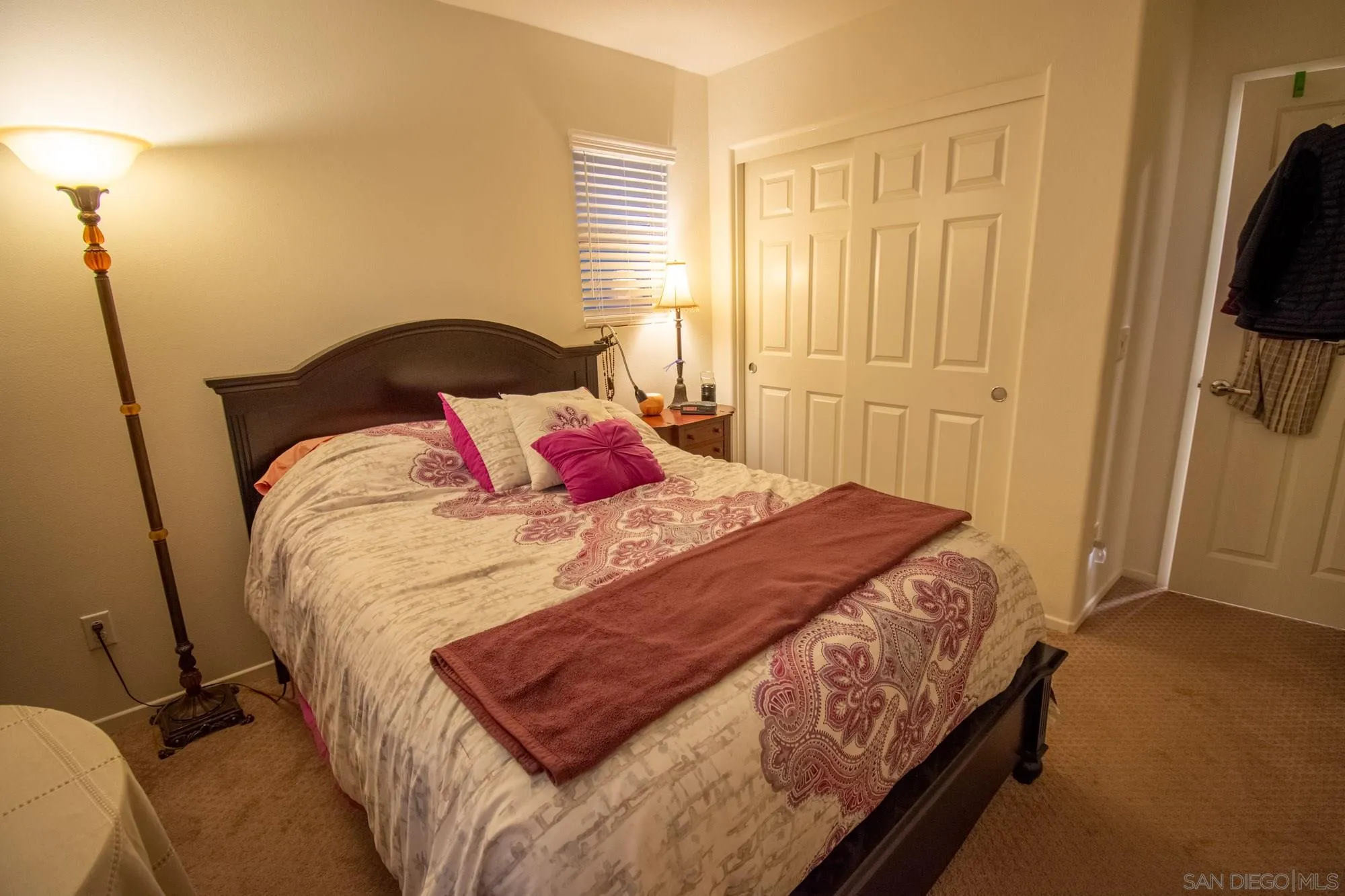 228 Oberlander Way Fallbrook, CA 92028 - Photo 13 of 23 a bedroom with a bed and flat tv screen