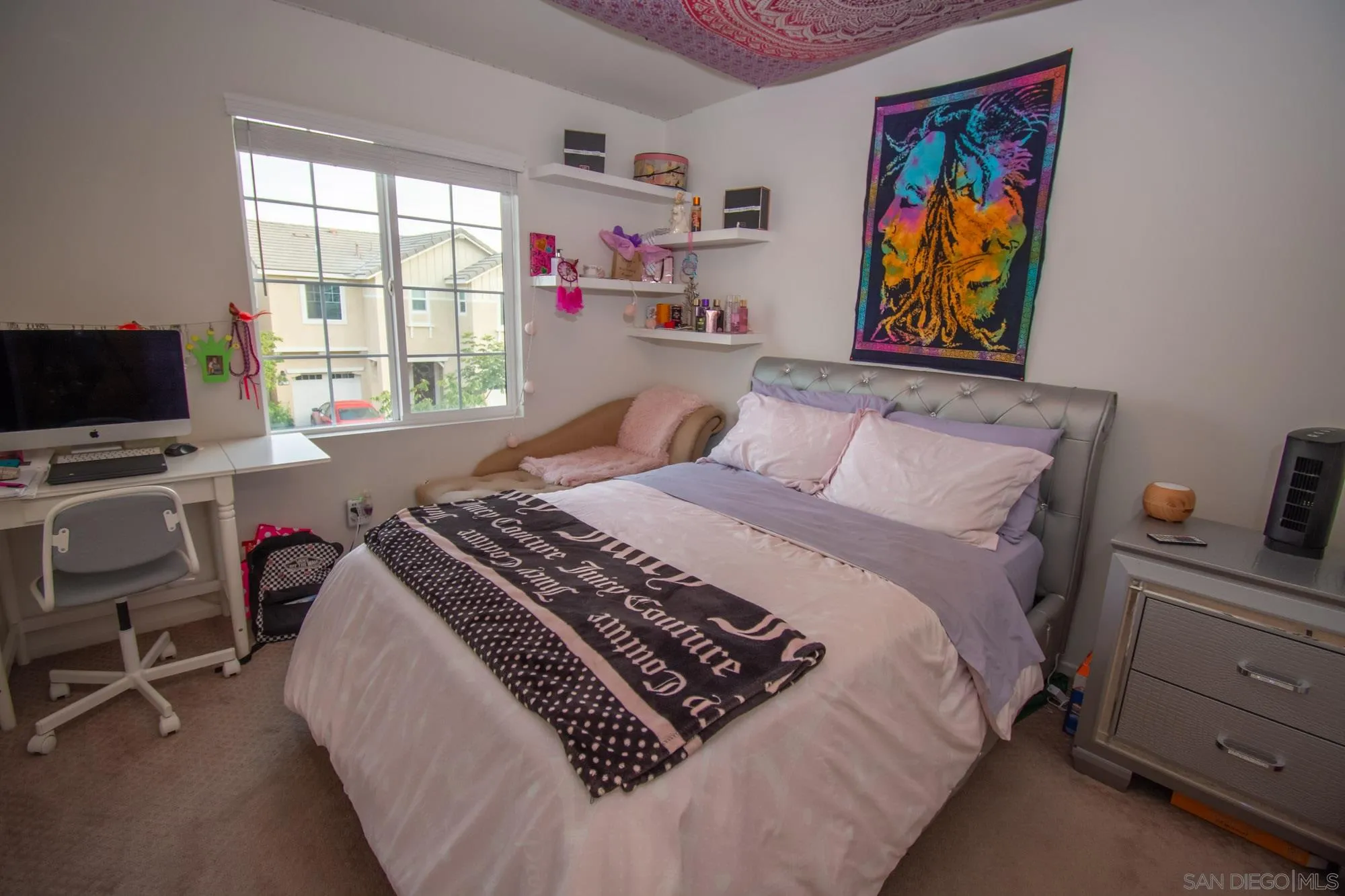 228 Oberlander Way Fallbrook, CA 92028 - Photo 16 of 23 a bedroom with a bed and a flat screen tv