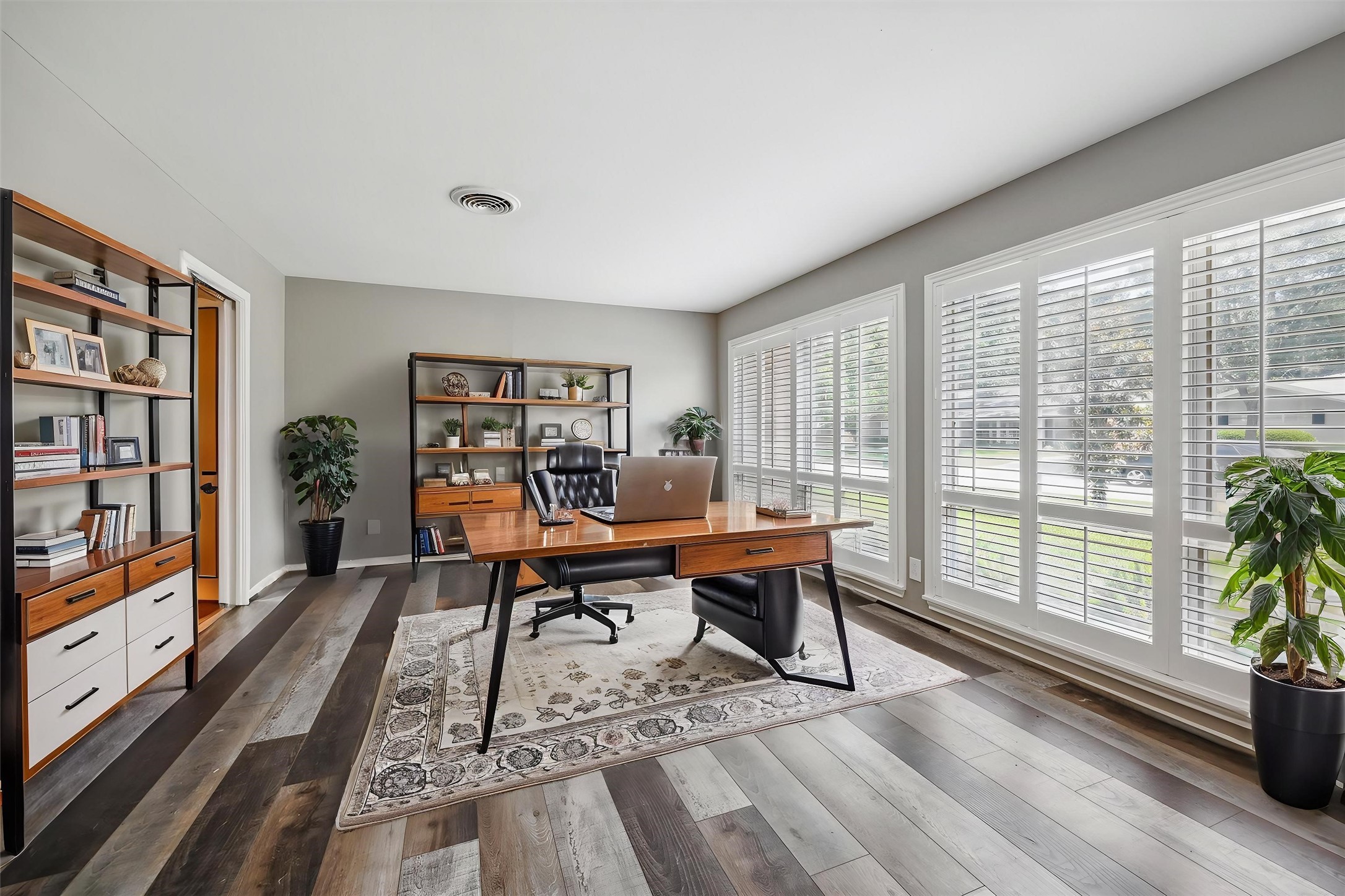 7222 Hartland Street Houston, TX 77055 - Photo 12 of 46 a work room with furniture wooden floor and windows