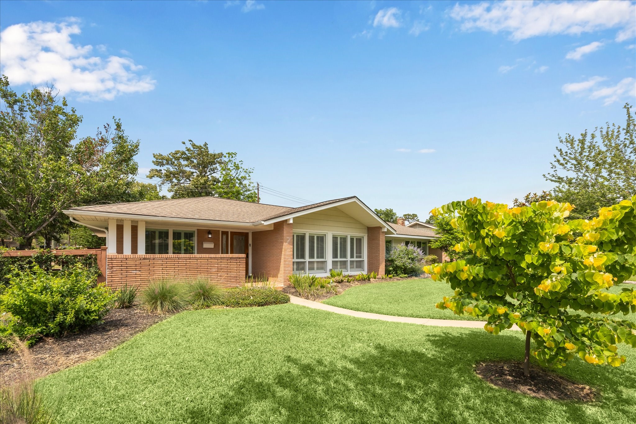 7222 Hartland Street Houston, TX 77055 - Photo 3 of 46 a front view of a house with a yard