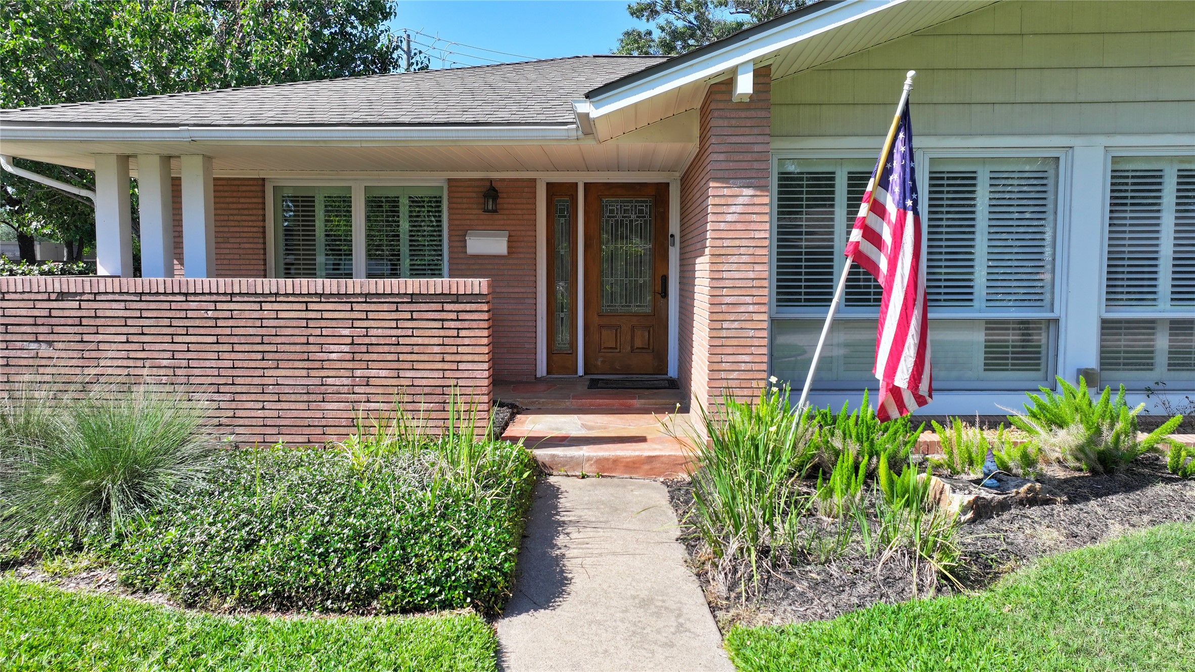 7222 Hartland Street Houston, TX 77055 - Photo 4 of 46 a view of a house with potted plants