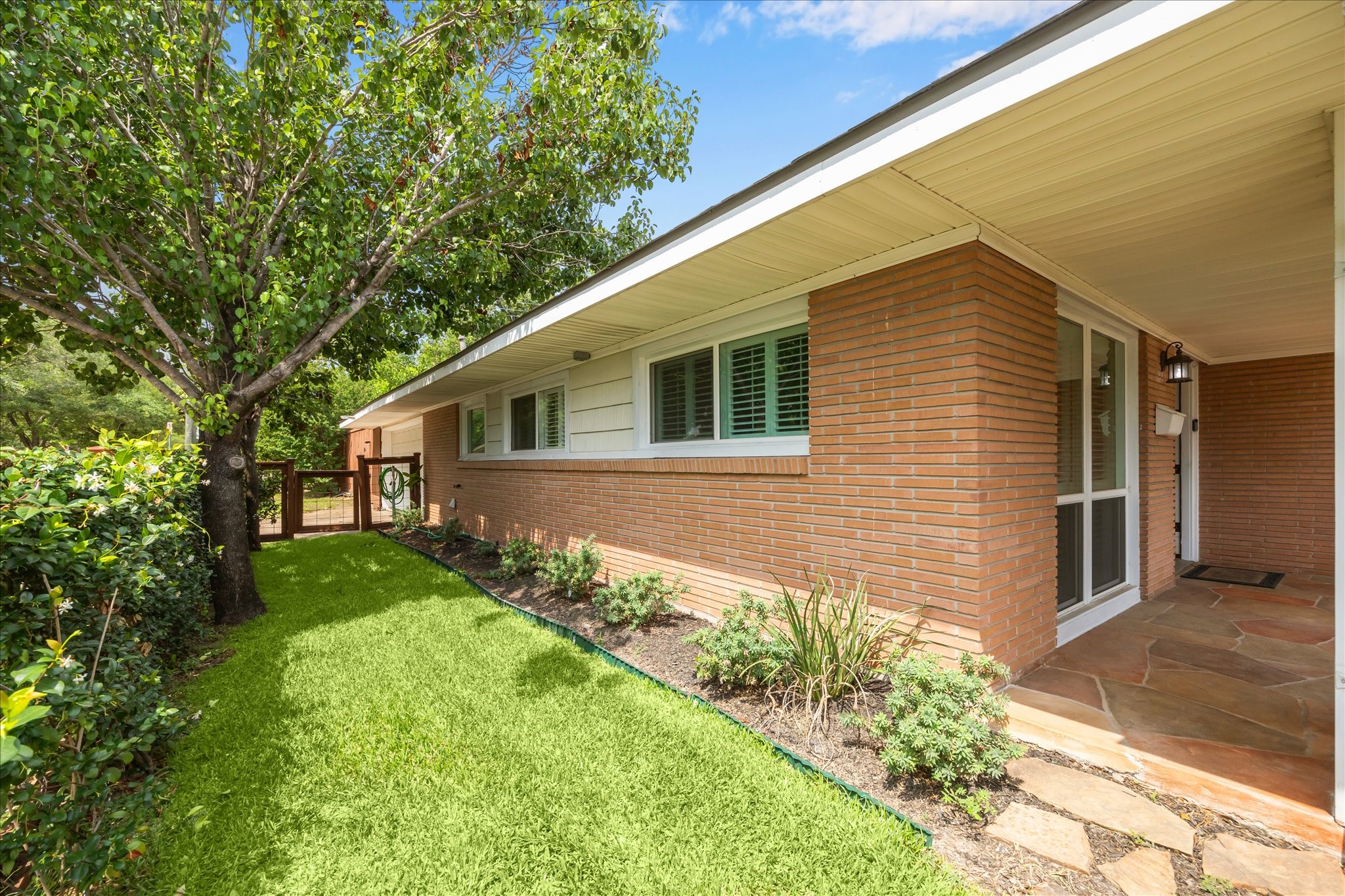 7222 Hartland Street Houston, TX 77055 - Photo 5 of 46 a front view of a house with garden
