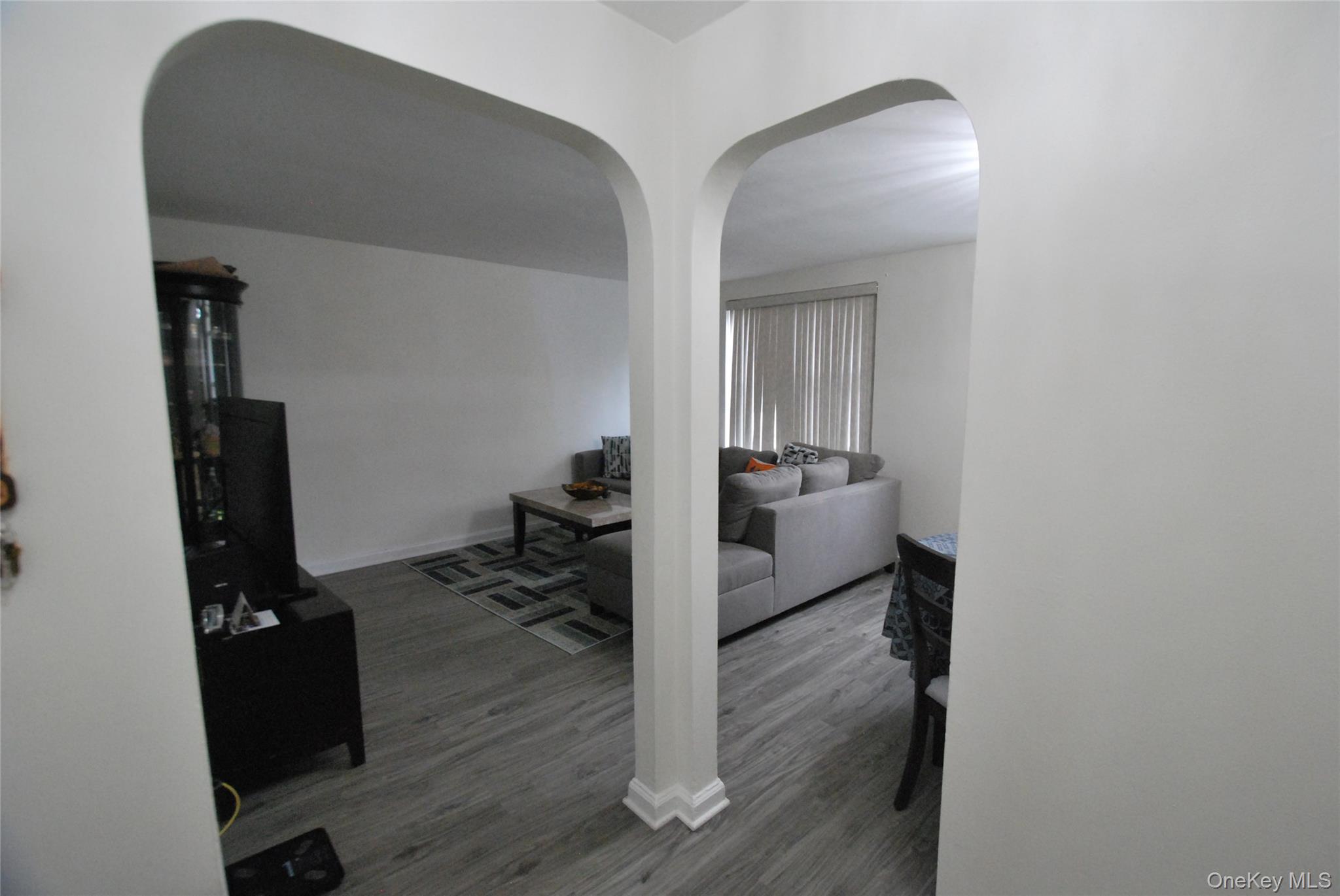 106 Richbell Road, Unit B2 Mamaroneck, NY 10543 - Photo 1 of 16 a view of a livingroom with wooden floor and furniture