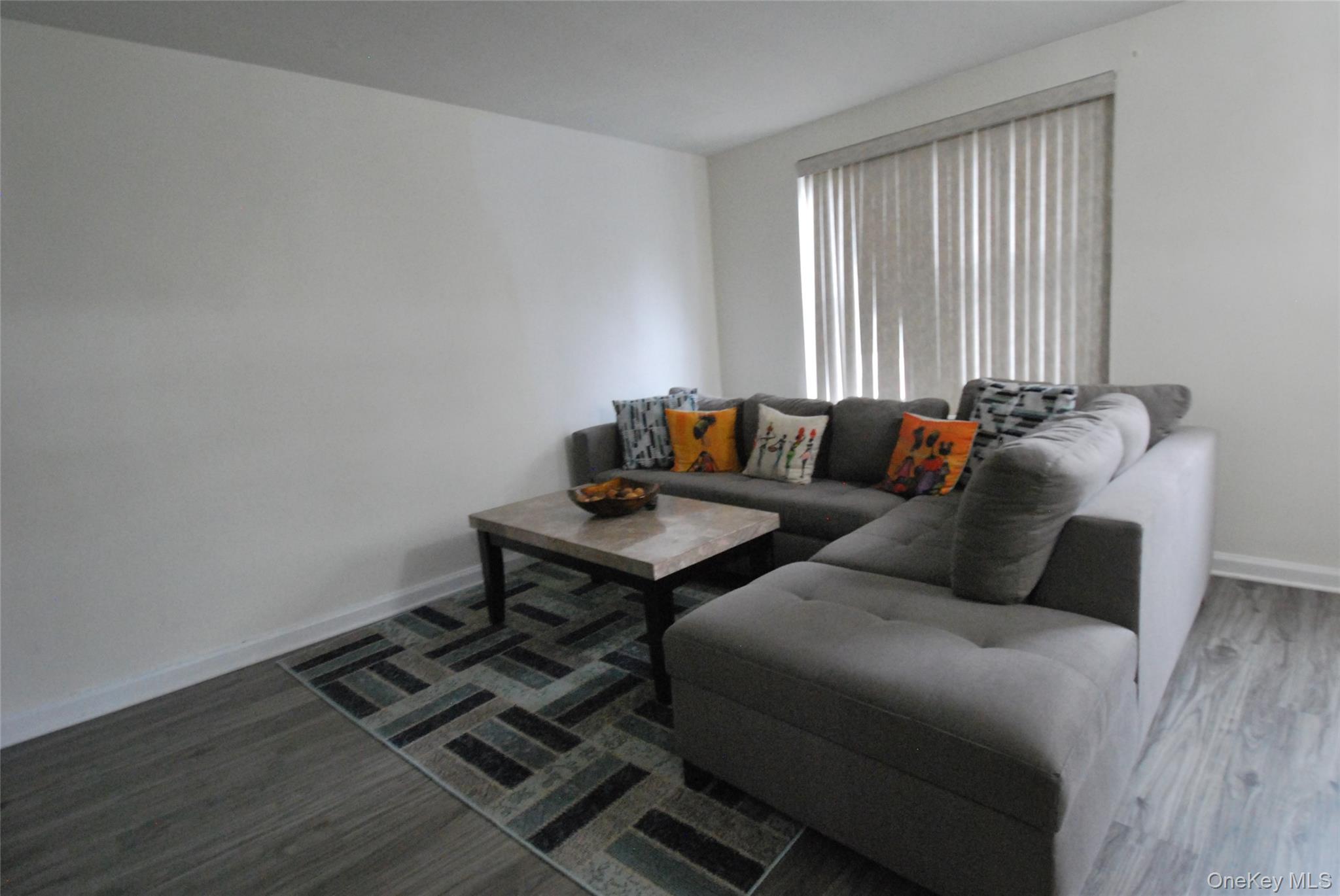 106 Richbell Road, Unit B2 Mamaroneck, NY 10543 - Photo 11 of 16 a living room with furniture and a window