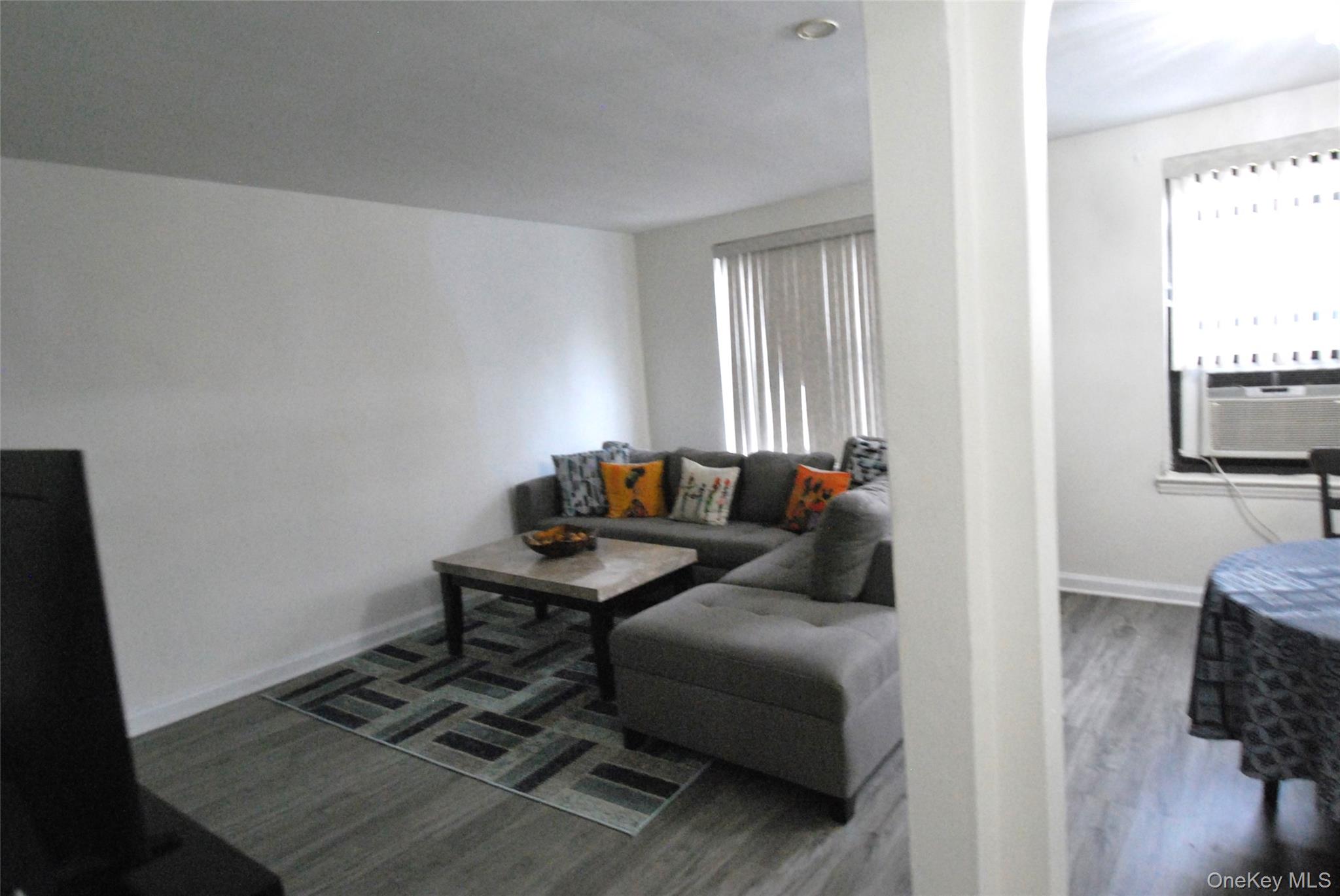 106 Richbell Road, Unit B2 Mamaroneck, NY 10543 - Photo 2 of 16 a living room with furniture and a window