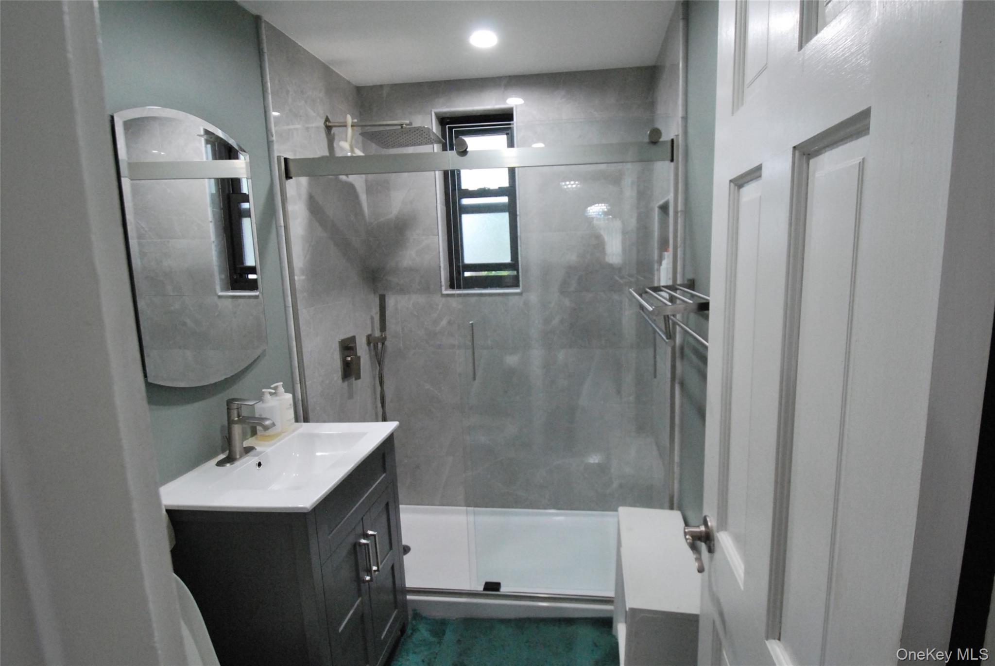 106 Richbell Road, Unit B2 Mamaroneck, NY 10543 - Photo 7 of 16 a bathroom with a sink toilet and shower
