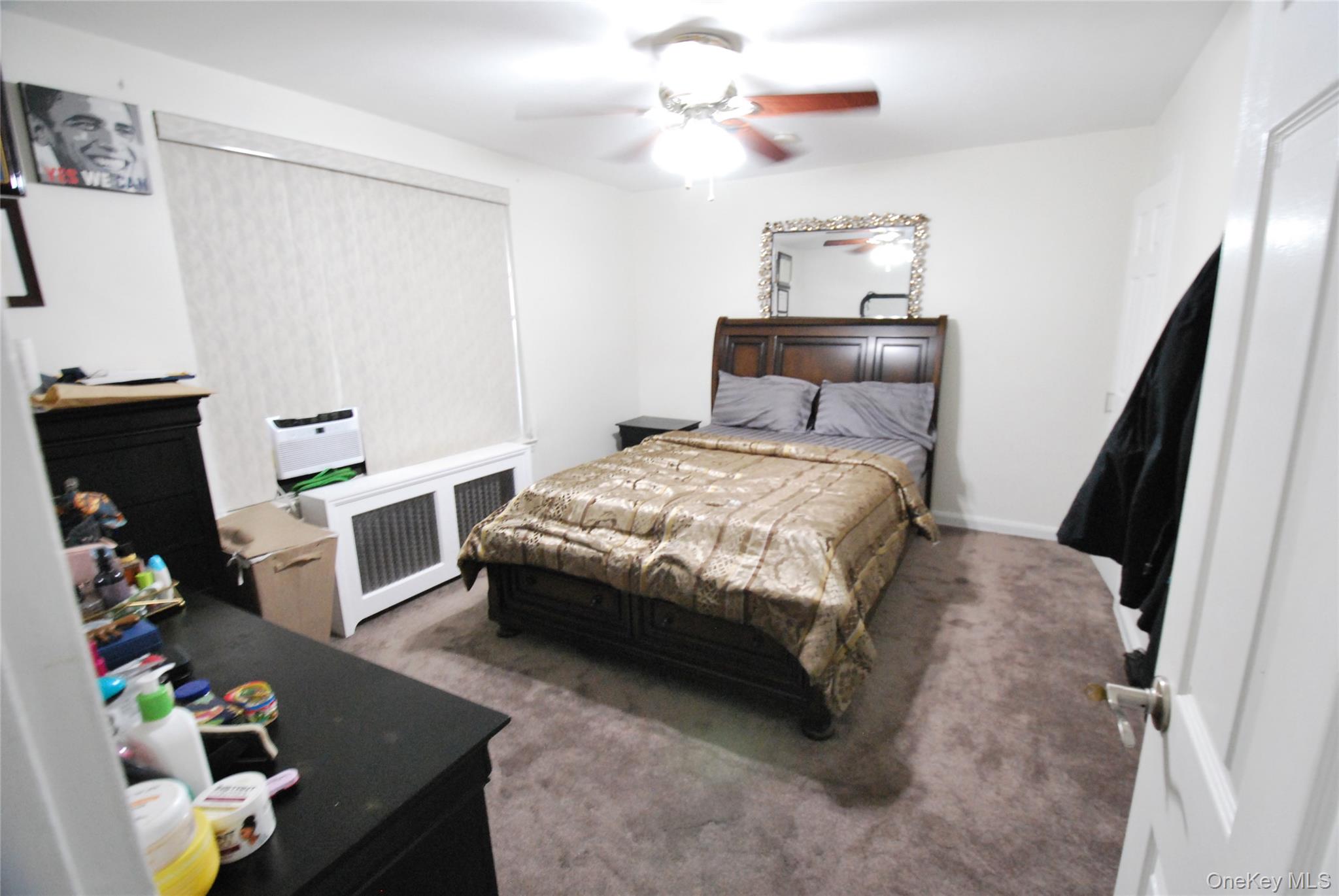 106 Richbell Road, Unit B2 Mamaroneck, NY 10543 - Photo 9 of 16 a bedroom with a bed dresser and a window