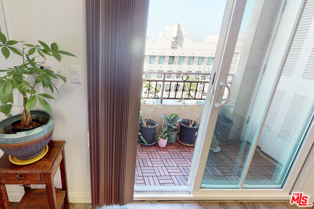 11 South 3rd Street, Unit 502 Alhambra, CA 91801 - Photo 12 of 33 a room with a table and a potted plant