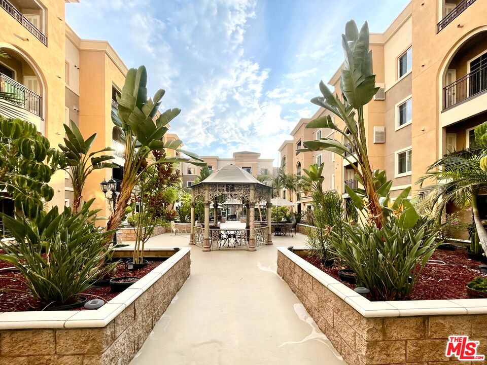 11 South 3rd Street, Unit 502 Alhambra, CA 91801 - Photo 15 of 33 a swimming pool with outdoor seating and yard