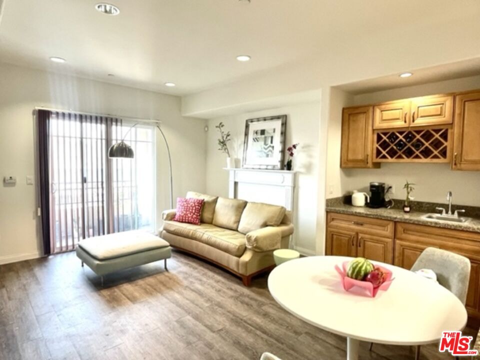 11 South 3rd Street, Unit 502 Alhambra, CA 91801 - Photo 21 of 33 a living room with furniture and a wooden floor