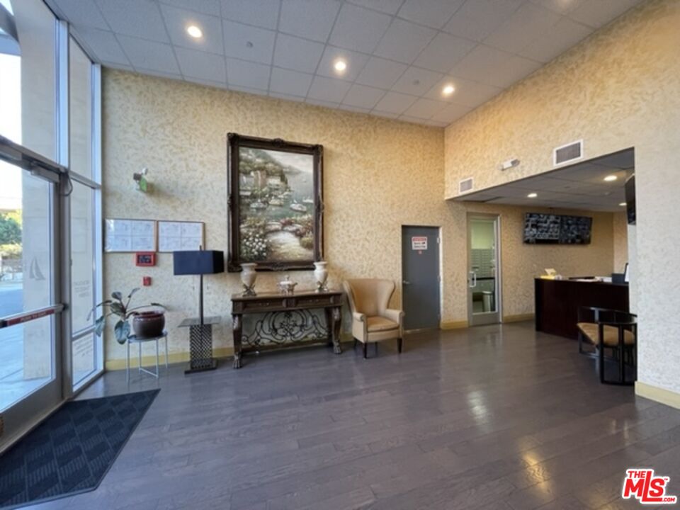11 South 3rd Street, Unit 502 Alhambra, CA 91801 - Photo 26 of 33 a living room with furniture and a flat screen tv