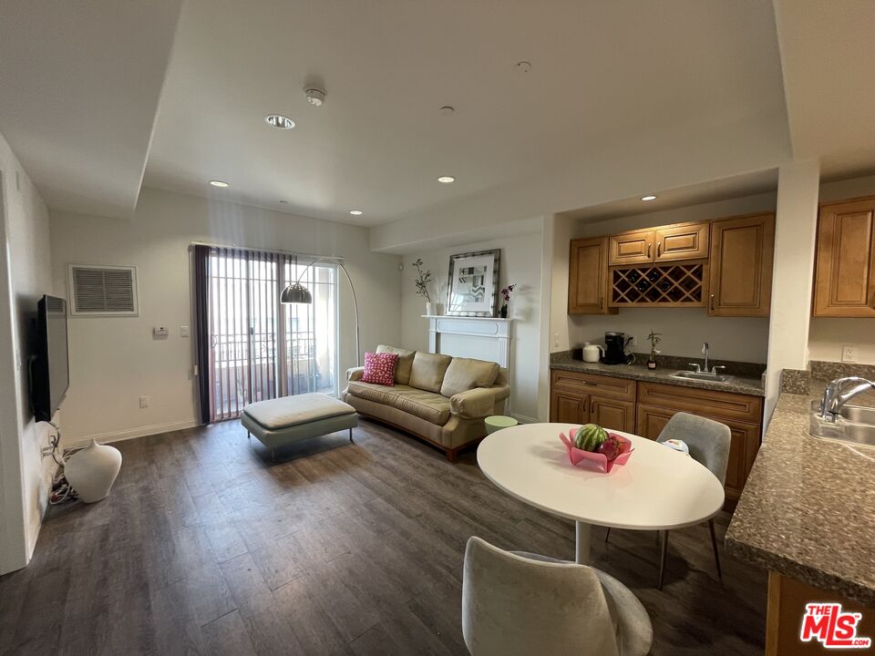 11 South 3rd Street, Unit 502 Alhambra, CA 91801 - Photo 30 of 33 a living room with furniture and a flat screen tv