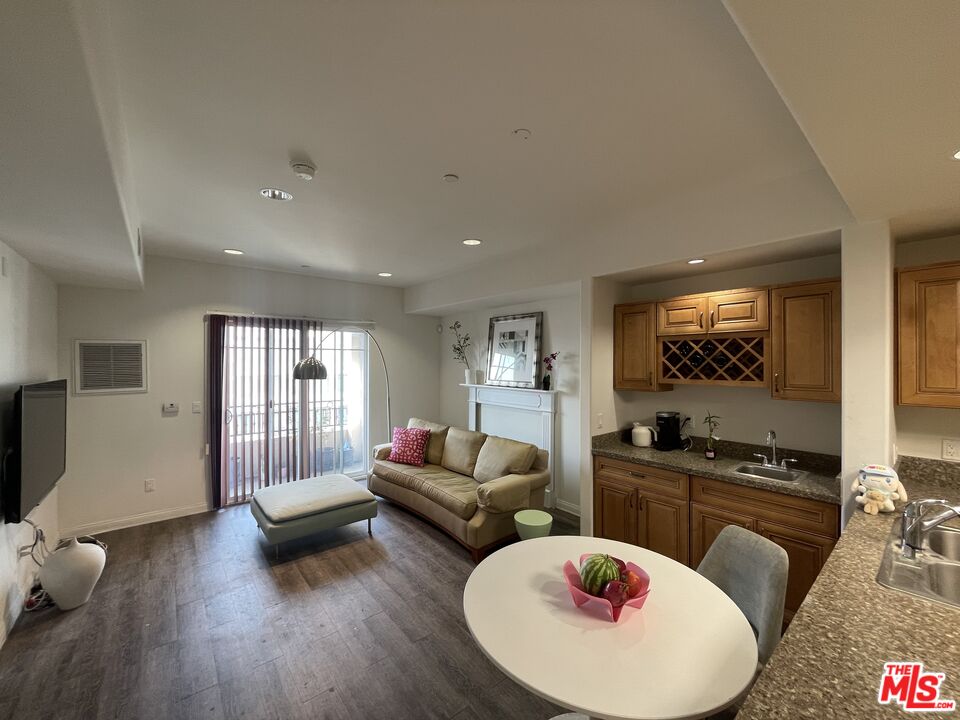 11 South 3rd Street, Unit 502 Alhambra, CA 91801 - Photo 31 of 33 a living room with furniture and a wooden floor