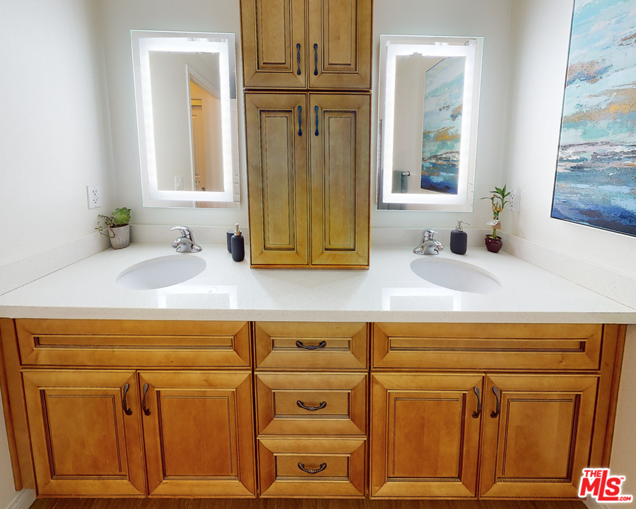 11 South 3rd Street, Unit 502 Alhambra, CA 91801 - Photo 9 of 33 a bathroom with a sink and a mirror