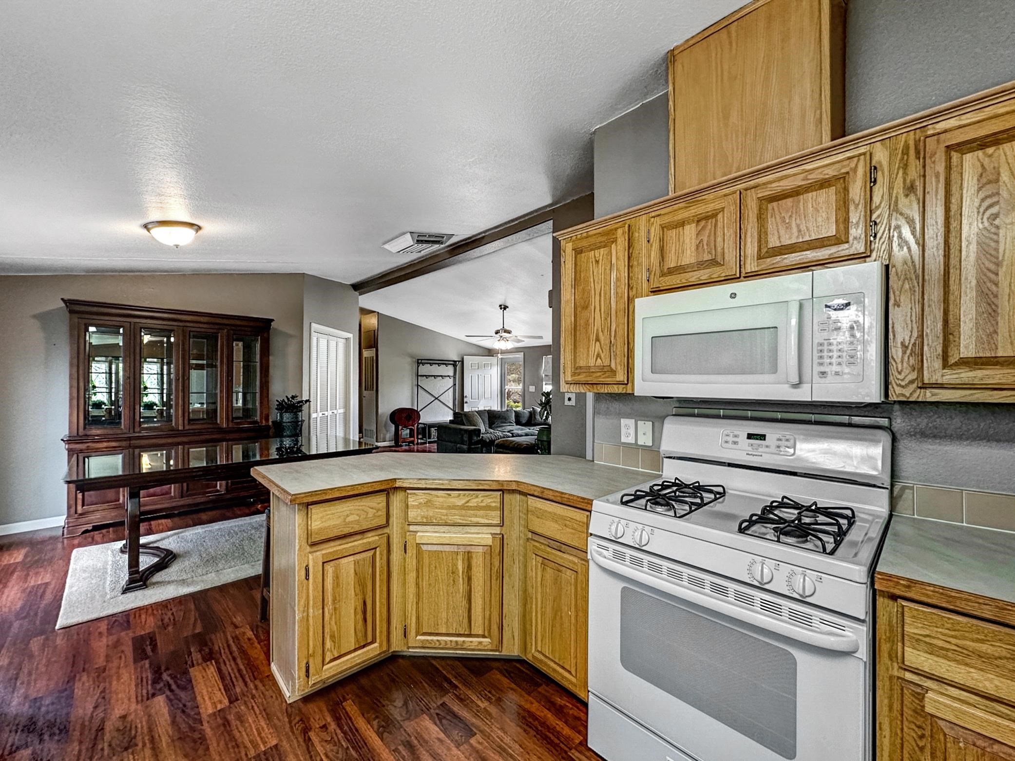 29501 P P 50 Road Hotchkiss, CO 81419 - Photo 15 of 33 a open kitchen with stainless steel appliances granite countertop a stove and a refrigerator