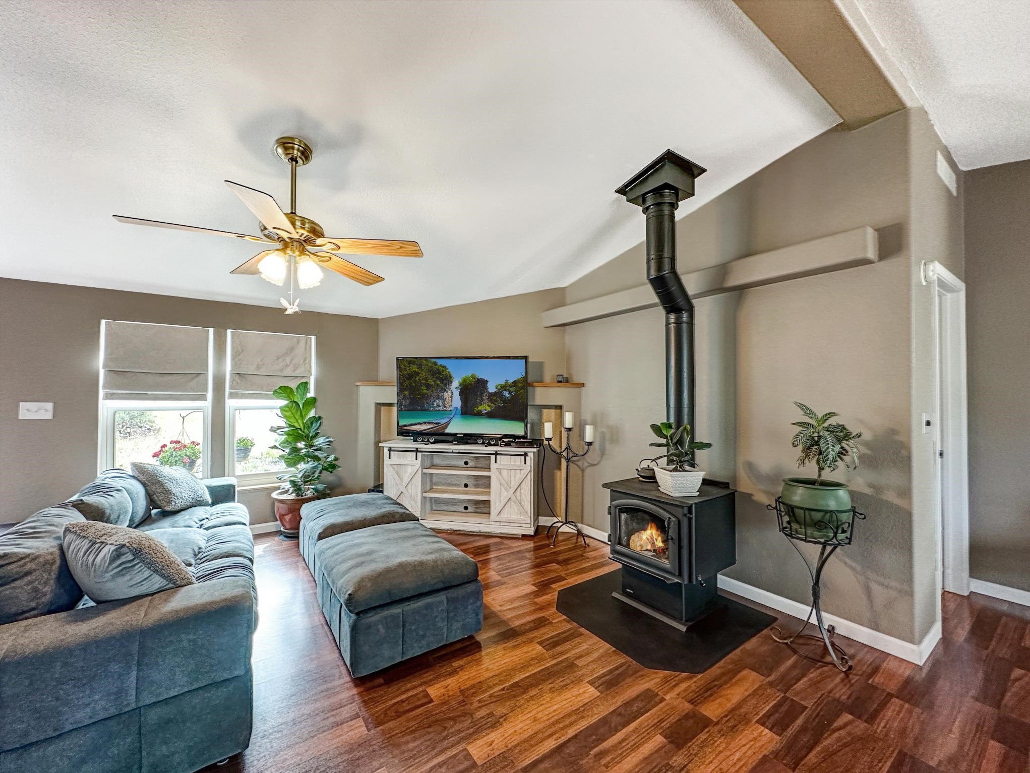 29501 P P 50 Road Hotchkiss, CO 81419 - Photo 25 of 33 a living room with furniture fireplace and flat screen tv