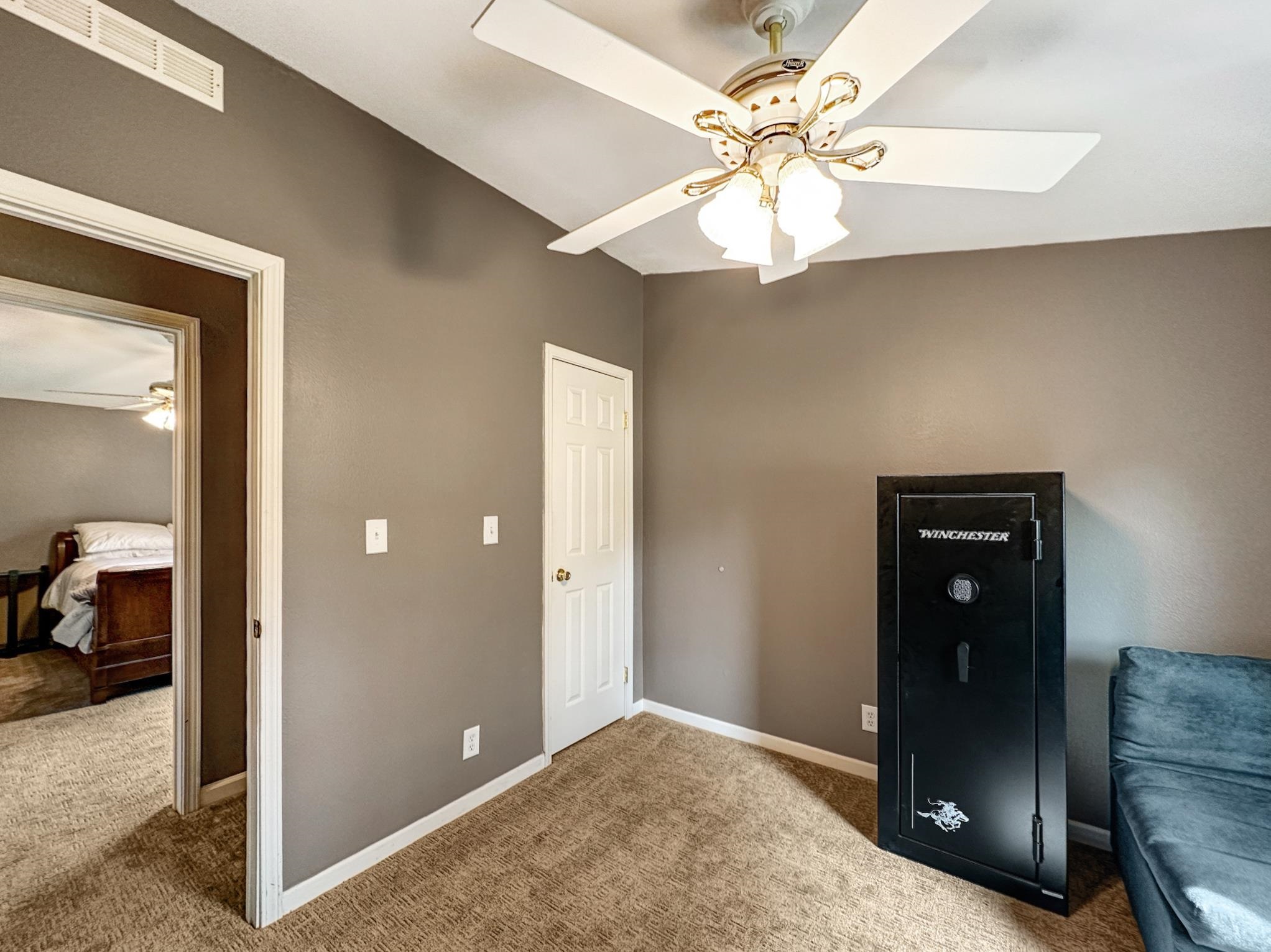 29501 P P 50 Road Hotchkiss, CO 81419 - Photo 27 of 33 a view of a livingroom with a chandelier fan and a chandelier fan