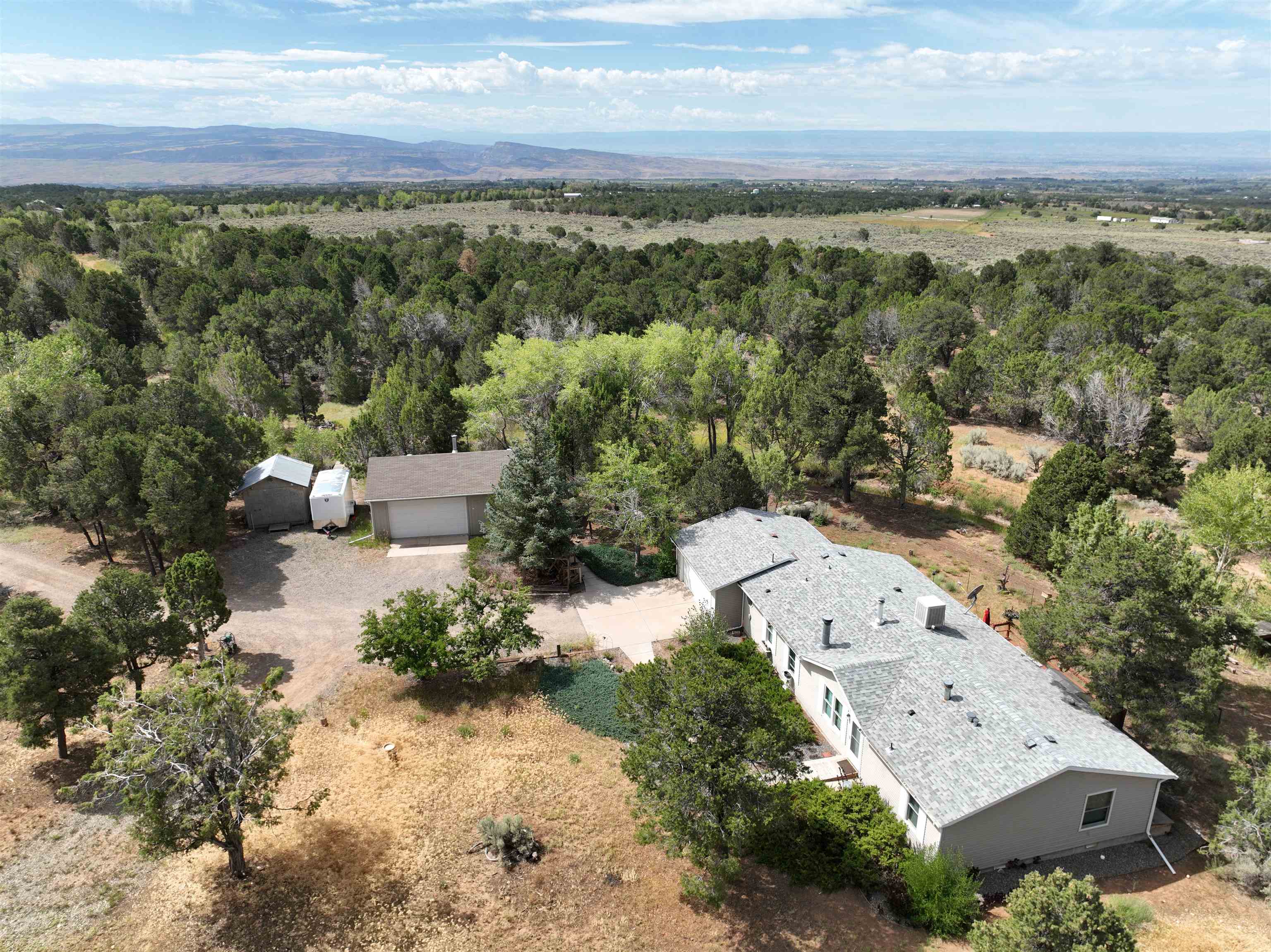 29501 P P 50 Road Hotchkiss, CO 81419 - Photo 3 of 33 an aerial view of a house with mountain view