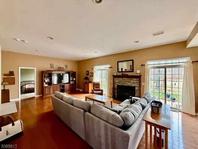 a living room with fireplace furniture and a fireplace