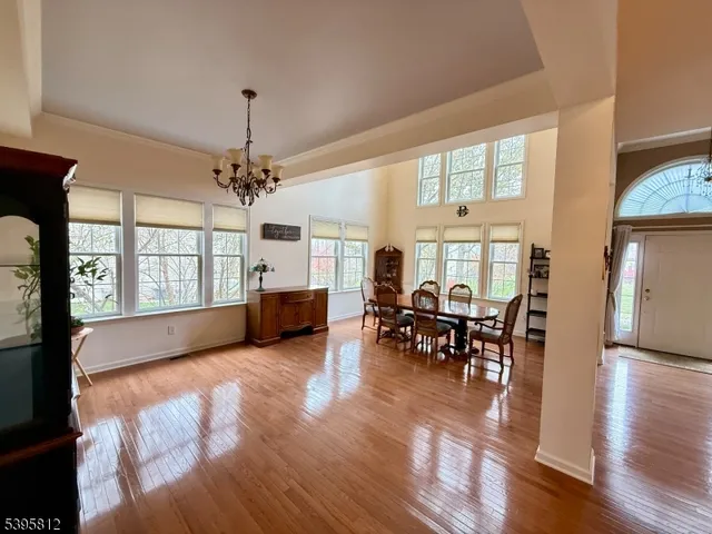a living room with furniture fireplace and a large window