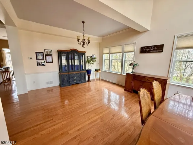 a view of a livingroom with furniture window and wooden floor