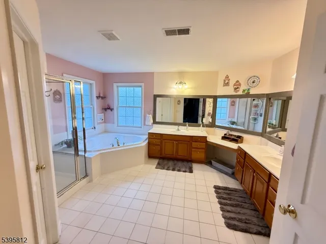 a large kitchen with a stove a sink and a refrigerator
