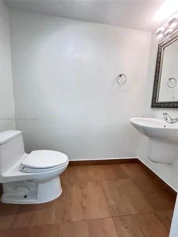 a view of a chair and table in backyard