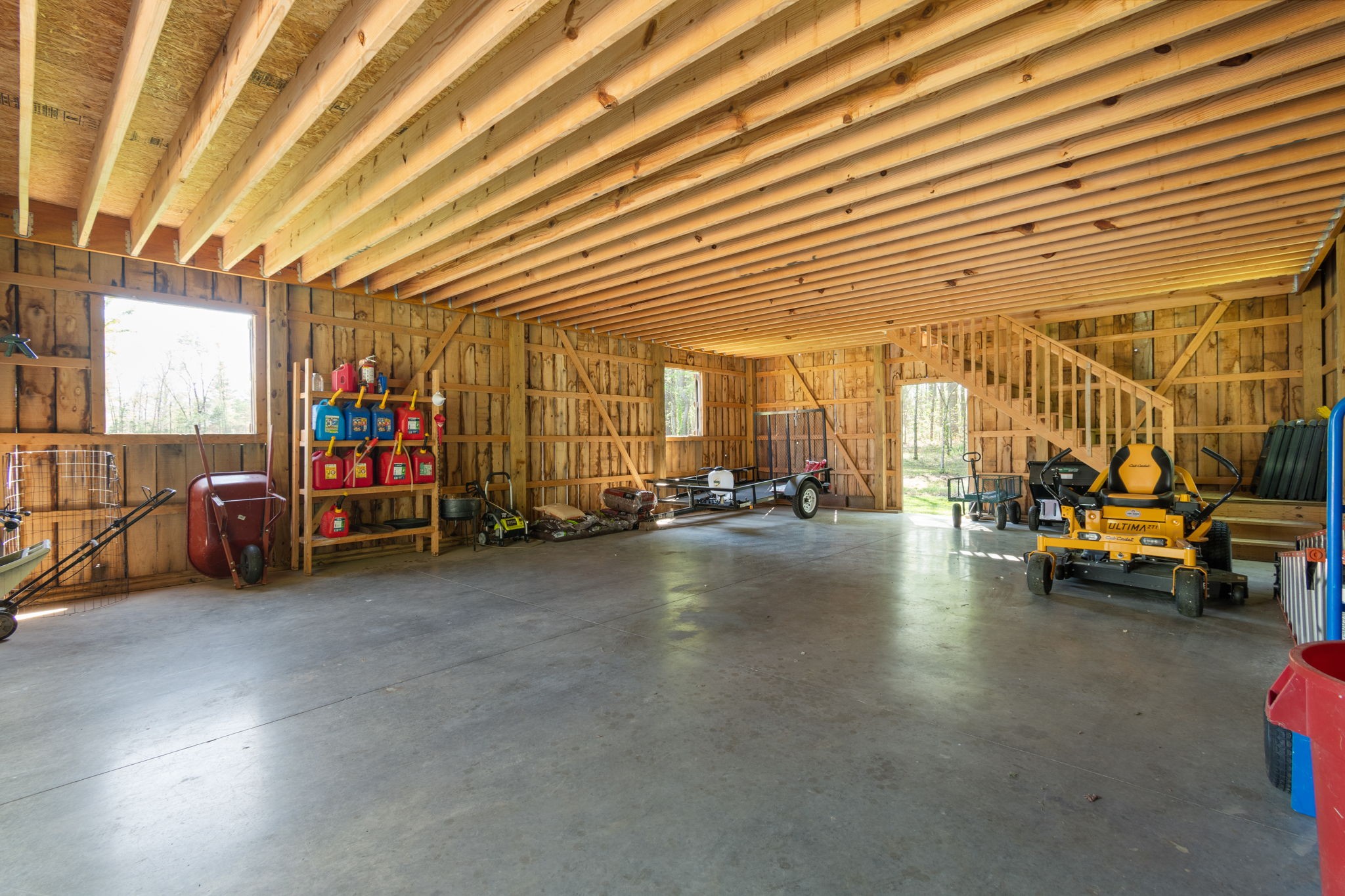 5609 Bending Chestnut Road Franklin, TN 37064 - Photo 20 of 24 a view of a studio with furniture and a garage