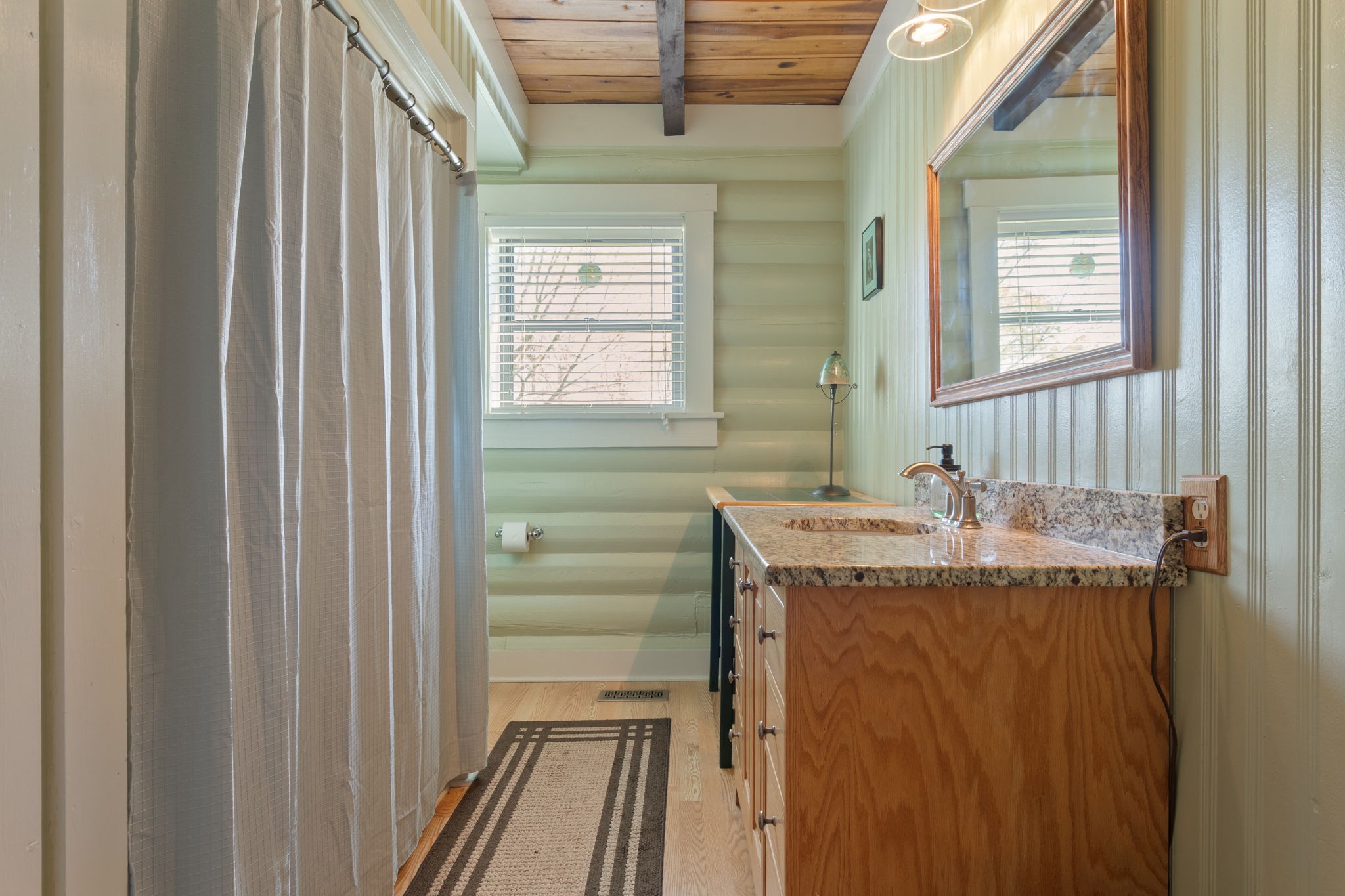 5609 Bending Chestnut Road Franklin, TN 37064 - Photo 10 of 24 a bathroom with a granite countertop sink and a mirror