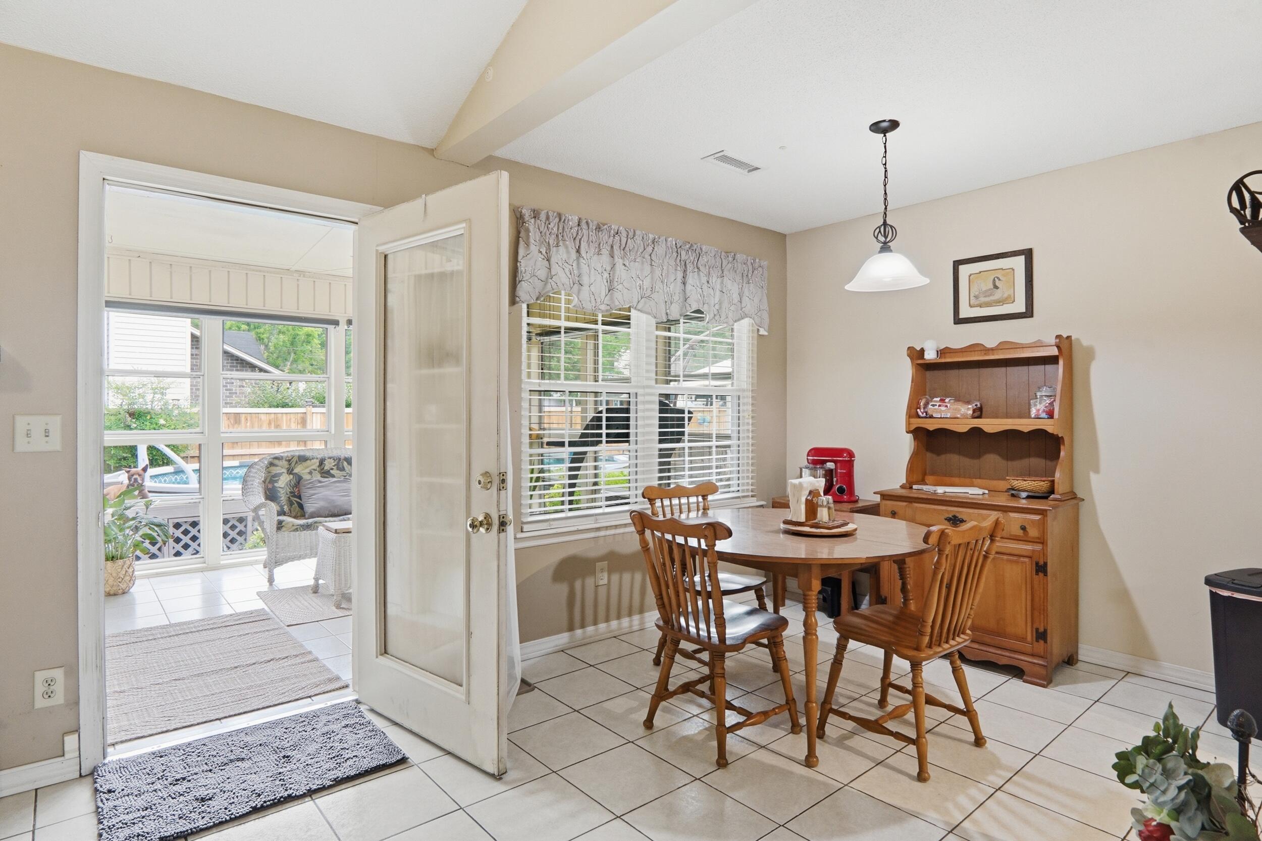 1778 Dogwood Road Charleston, SC 29414 - Photo 14 of 49 Dining to screened porch
