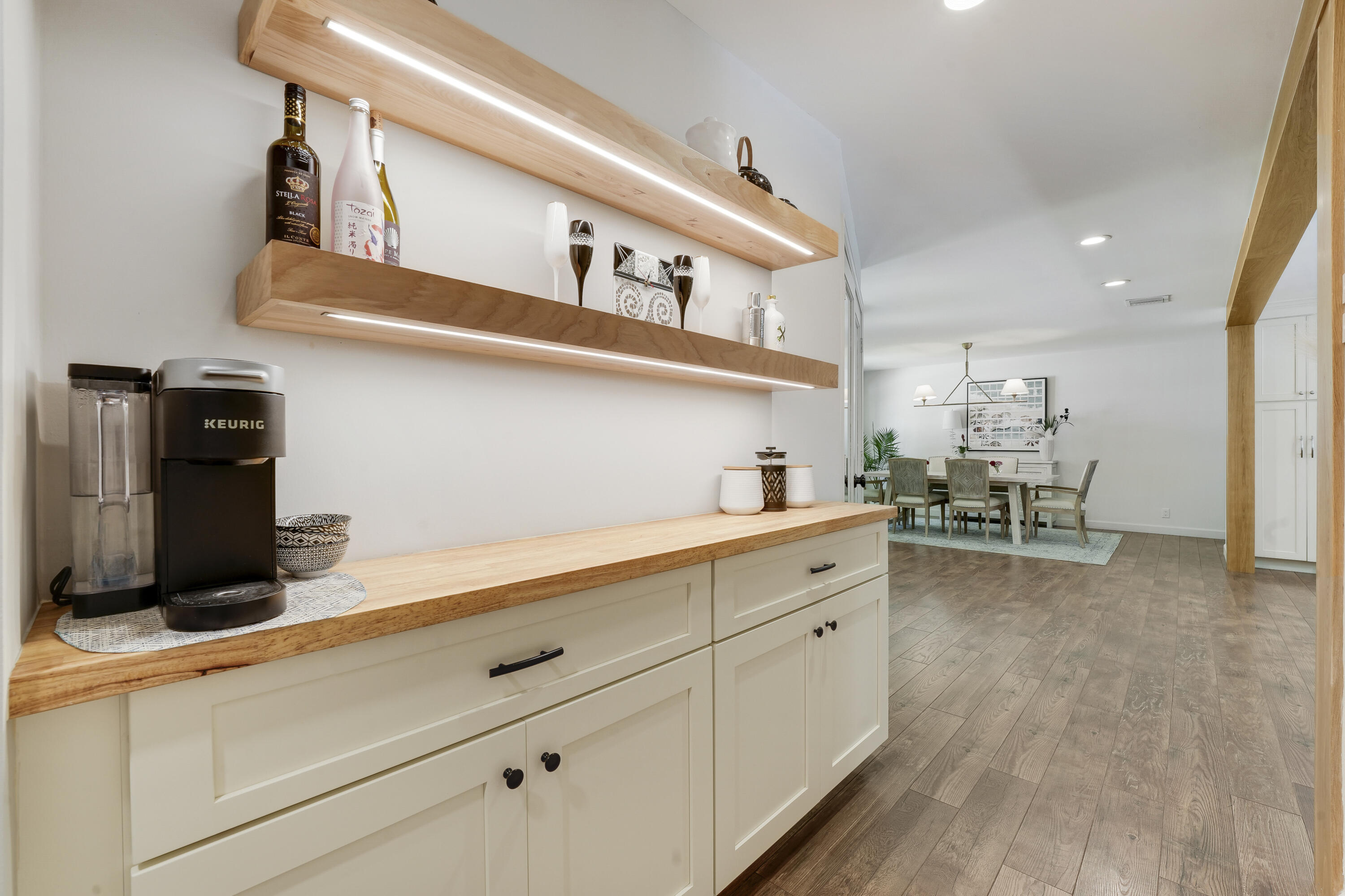 18784 Falcon Way Jupiter, FL 33458 - Photo 12 of 47 a kitchen with cabinets and wooden floor