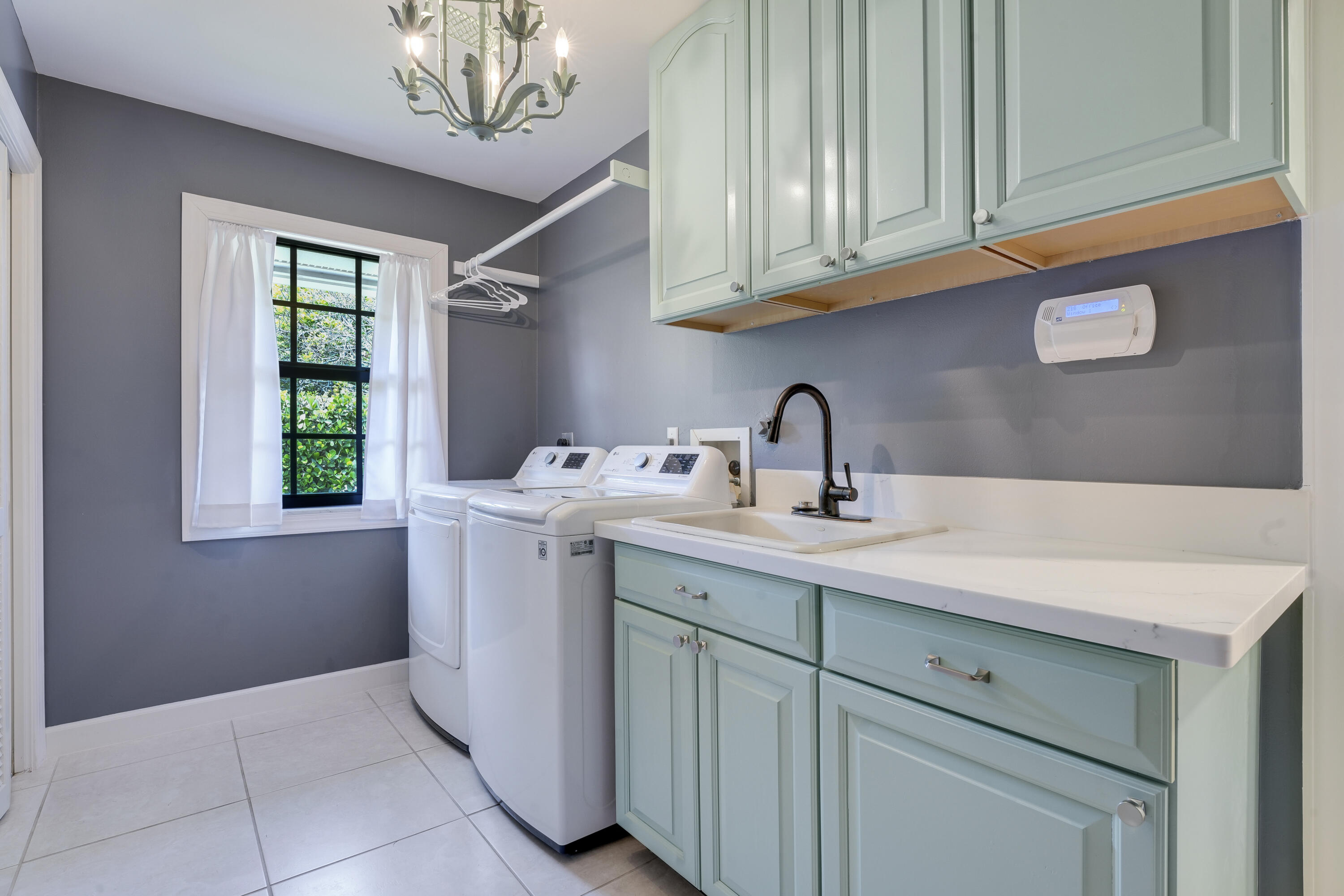 18784 Falcon Way Jupiter, FL 33458 - Photo 27 of 47 a kitchen with a sink cabinets and window