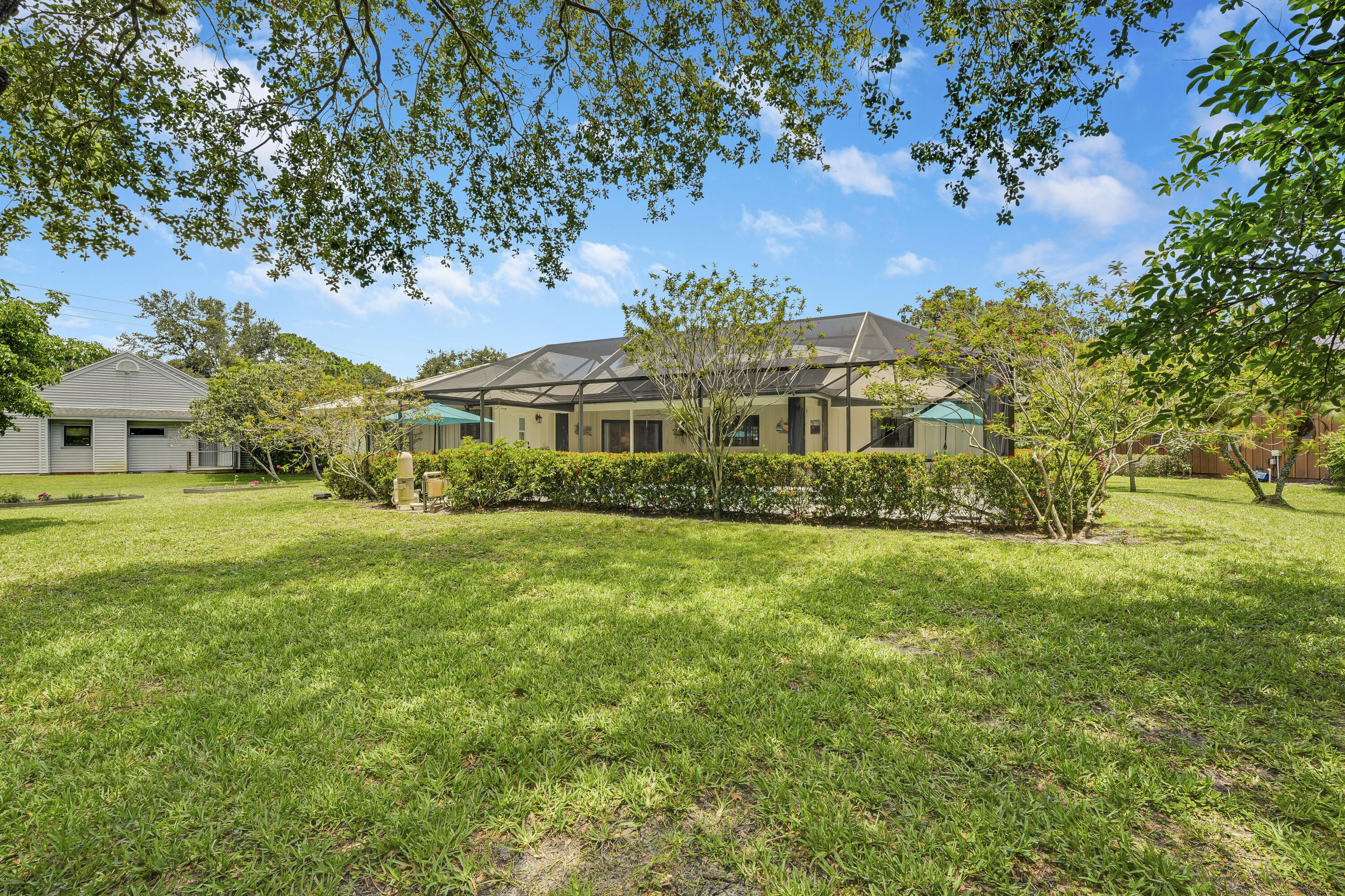 18784 Falcon Way Jupiter, FL 33458 - Photo 36 of 47 a view of a house with a big yard