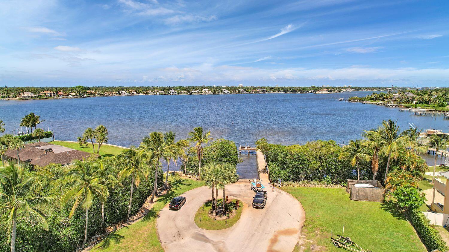 18784 Falcon Way Jupiter, FL 33458 - Photo 40 of 47 swimming view with a lake view