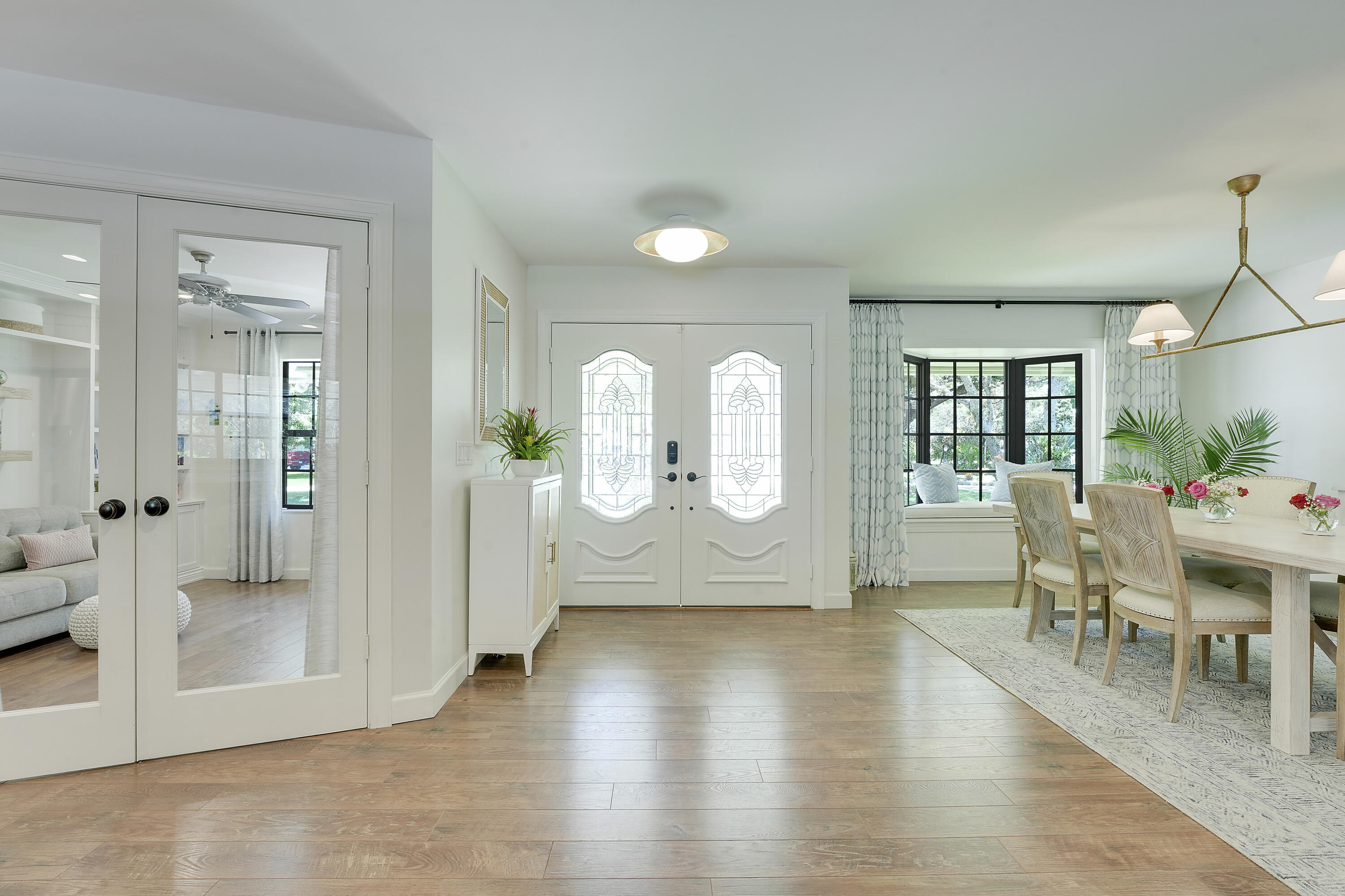 18784 Falcon Way Jupiter, FL 33458 - Photo 5 of 47 a view of a living room and dining room with furniture