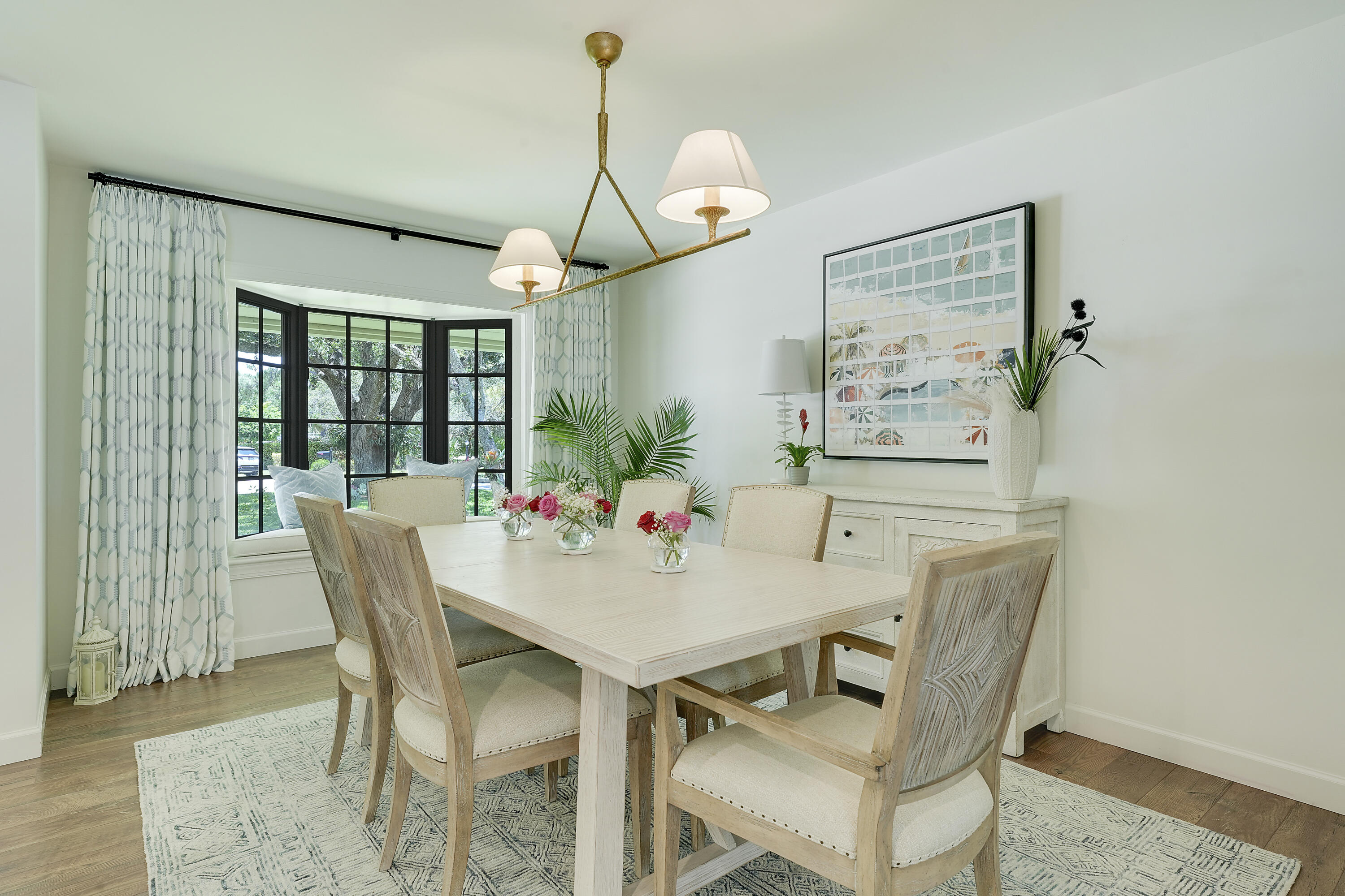 18784 Falcon Way Jupiter, FL 33458 - Photo 7 of 47 a view of a dining room with furniture window and wooden floor