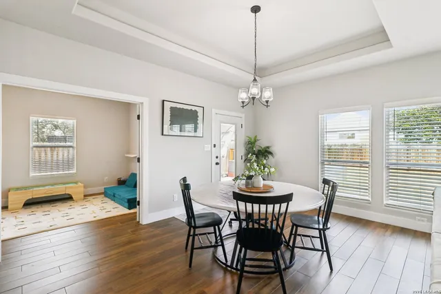 a view of a dining room with furniture window and wooden floor