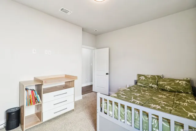 a bedroom with a bed and closet