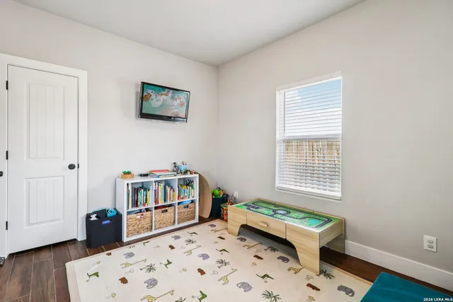 a bedroom with furniture and a window