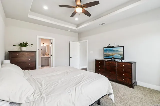 a bedroom with a bed and a dresser