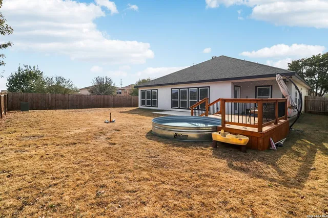 a view of swimming pool with outdoor seating