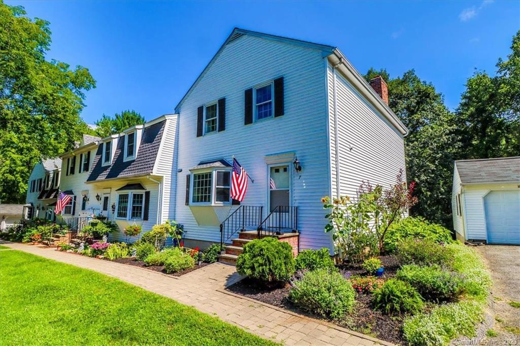 7 Bridgewater Common, Unit 7 Bridgewater, CT 06752 - Photo 1 of 1 a front view of a house with a yard