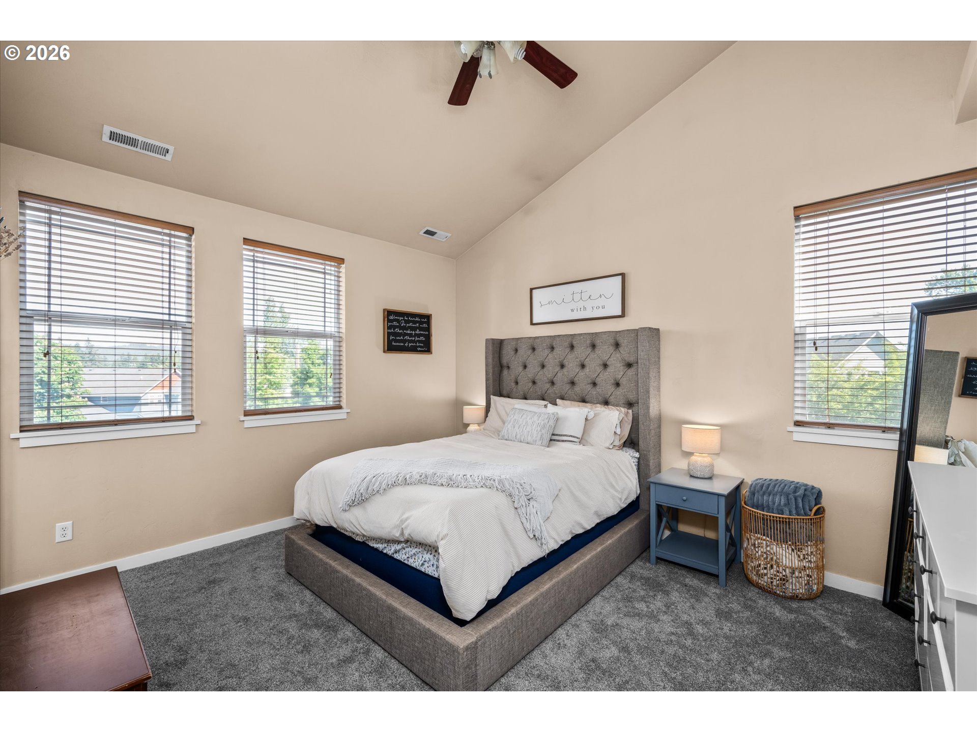 277 South 67th Court Springfield, OR 97478 - Photo 14 of 44 a bedroom with a bed a table and windows