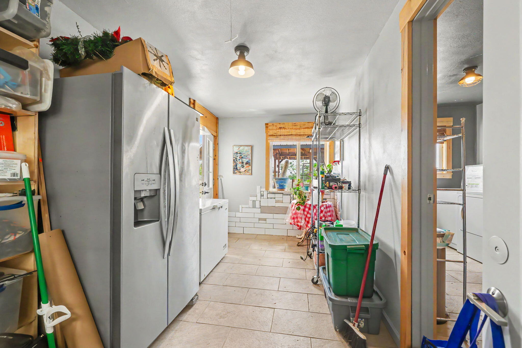 145 Highway 234 Eagle Point, OR 97524 - Photo 27 of 43 a kitchen with stainless steel appliances a refrigerator and a view of living room
