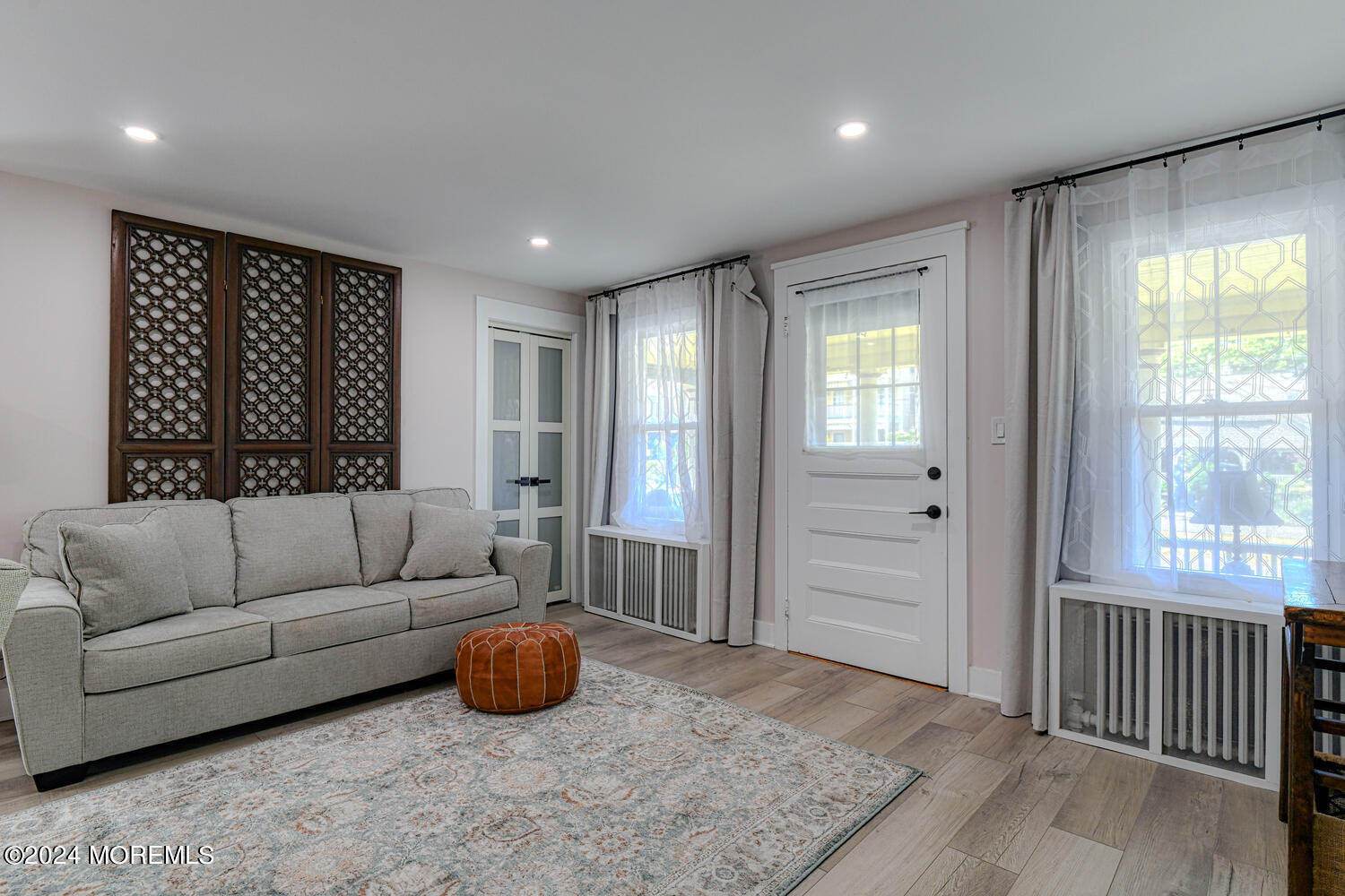 83 Broadway Ocean Grove, NJ 07756 - Photo 12 of 40 a living room with furniture and a window