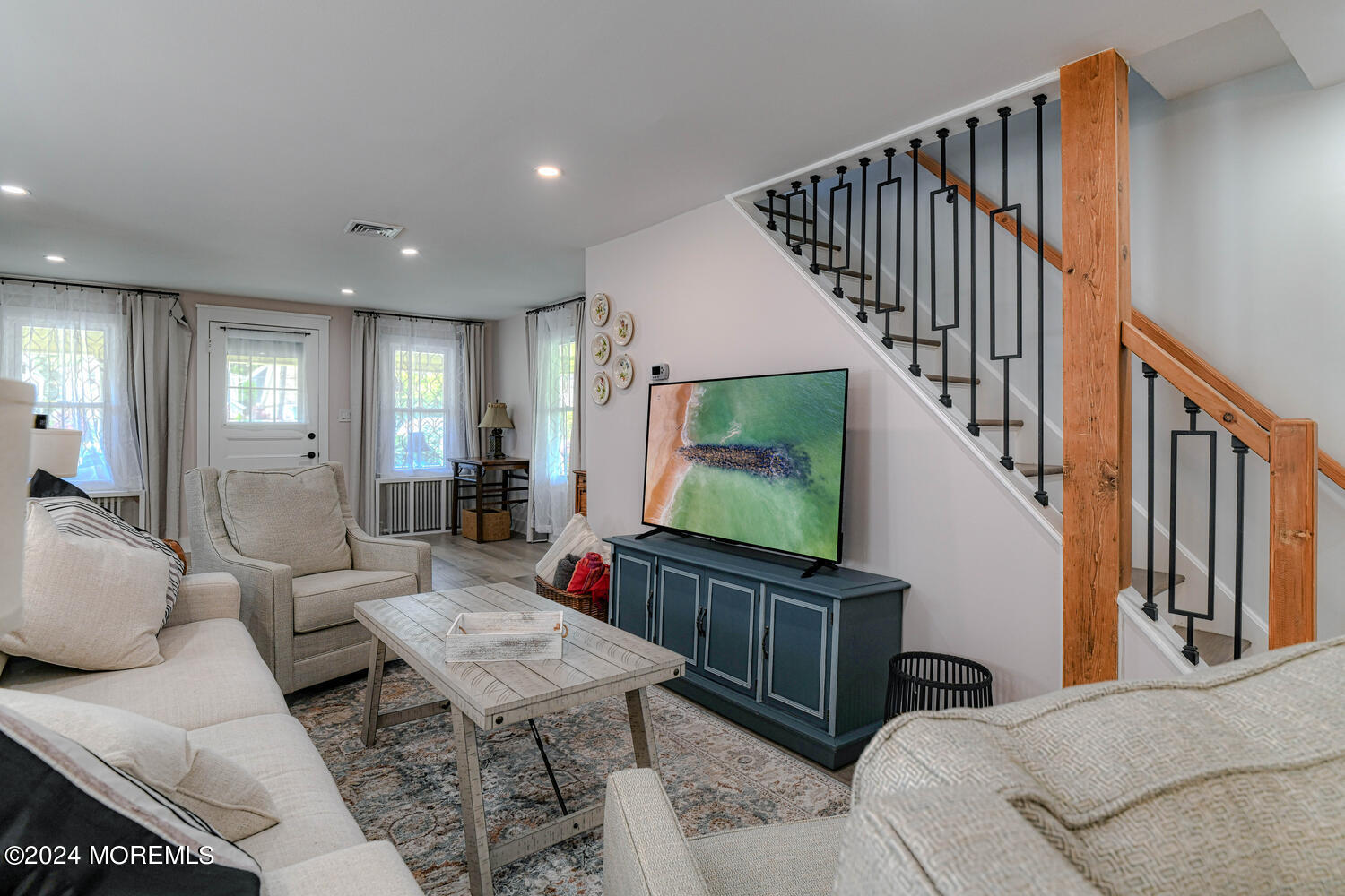 83 Broadway Ocean Grove, NJ 07756 - Photo 13 of 40 a living room with furniture and a flat screen tv